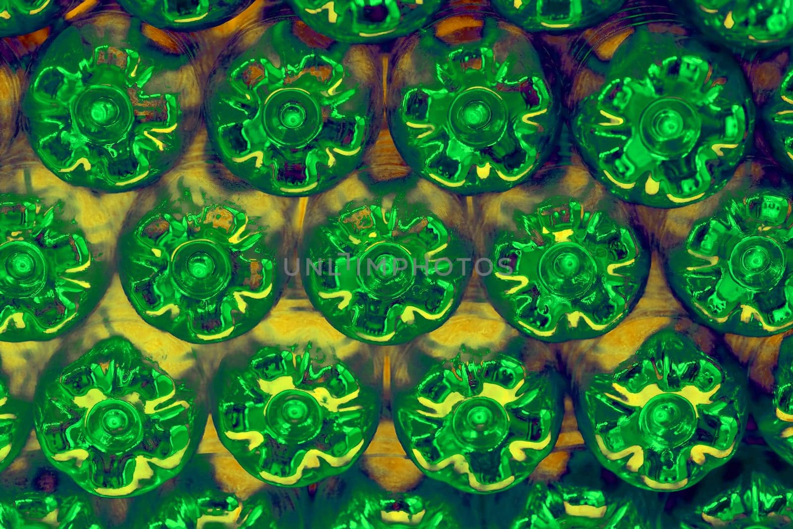 Abstract wall made from the bottoms of green plastic bottles by jovani68