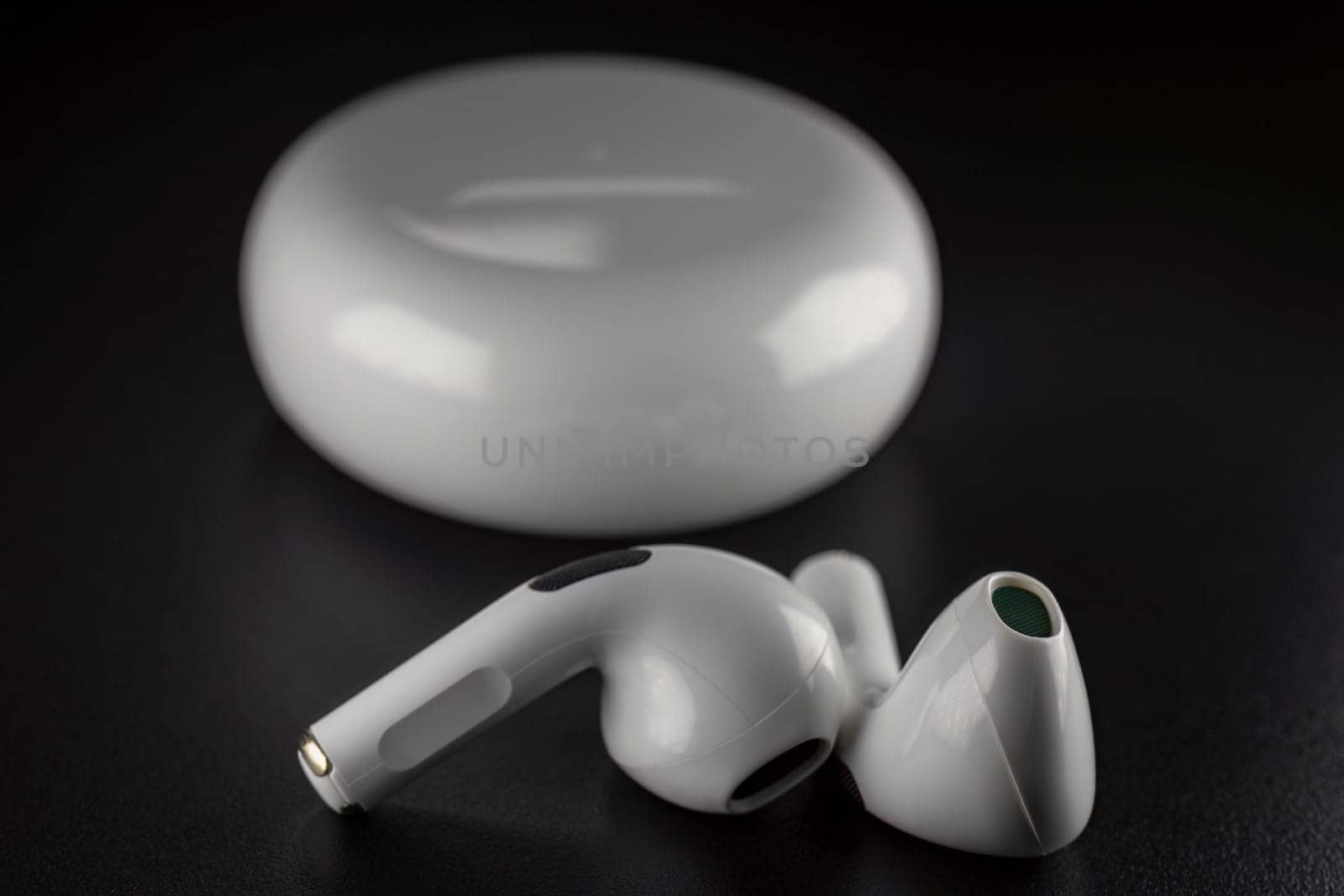 ROSTOV-ON-DON, RUSSIA - APRIL 28, 2018: Apple AirPods wireless Bluetooth headphones and charging case for Apple iPhone. New Apple Earpods Airpods in box.