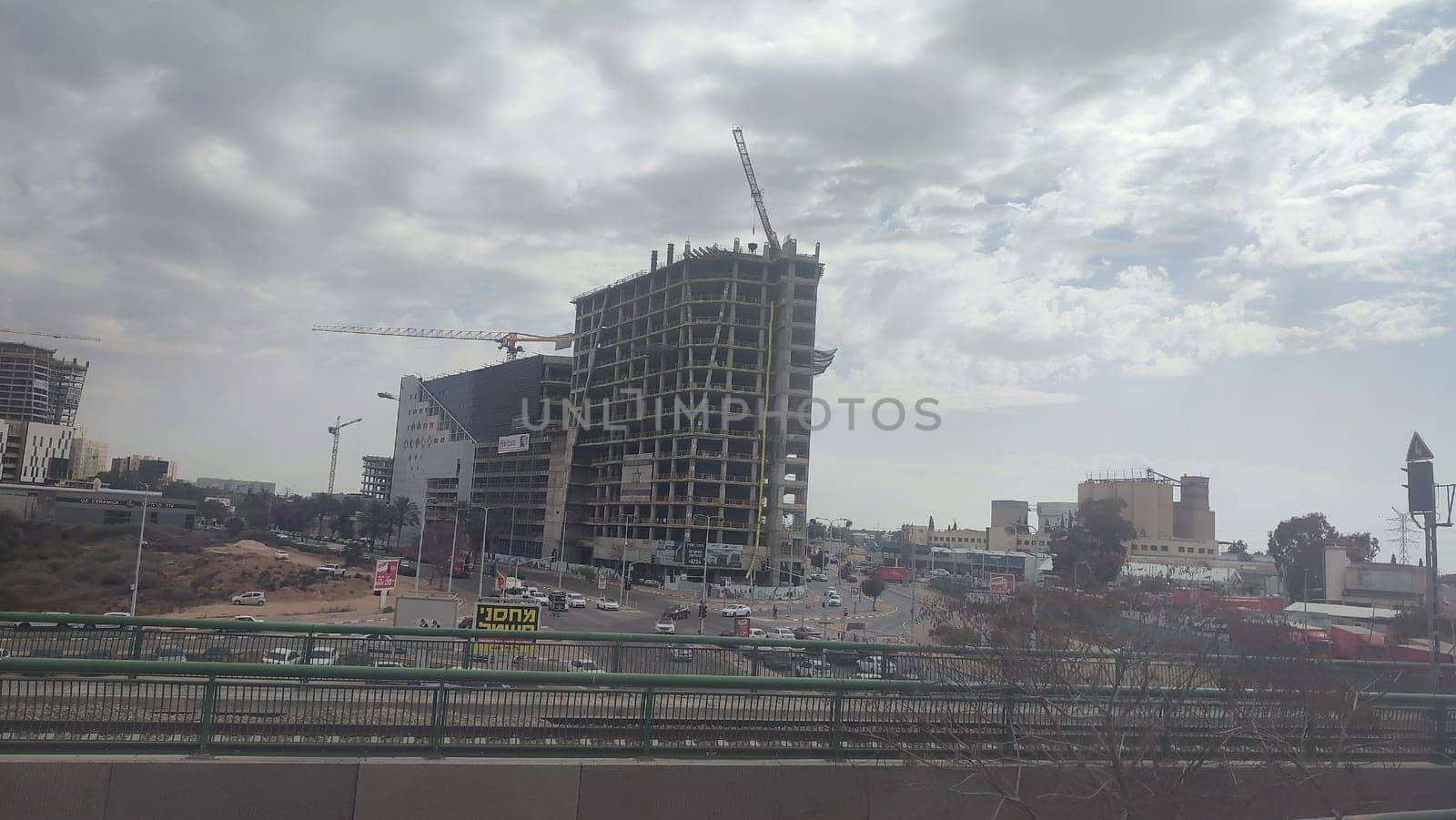 construction of a new residential and office building along the railway, city, transport. High quality photo