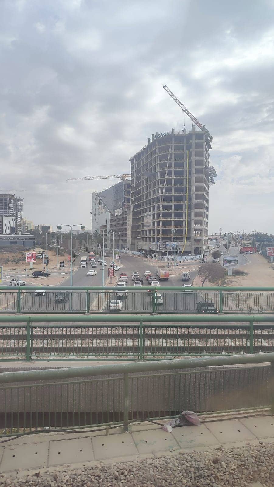 construction of a new residential and office building along the railway, city, transport. High quality photo