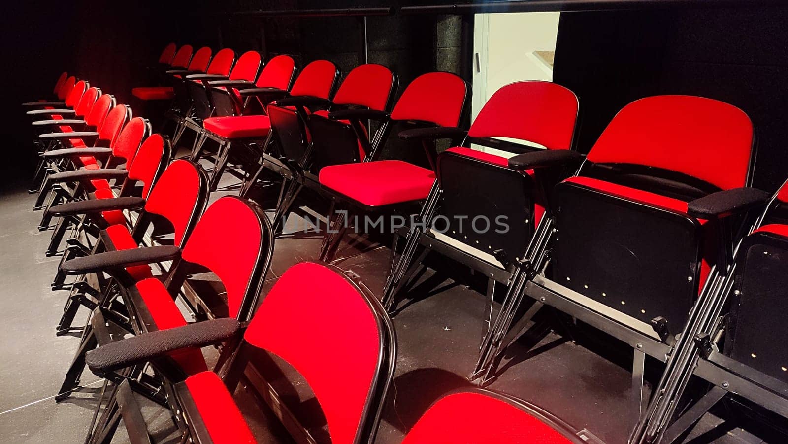 red chairs in the theater, a row of objects. High quality photo
