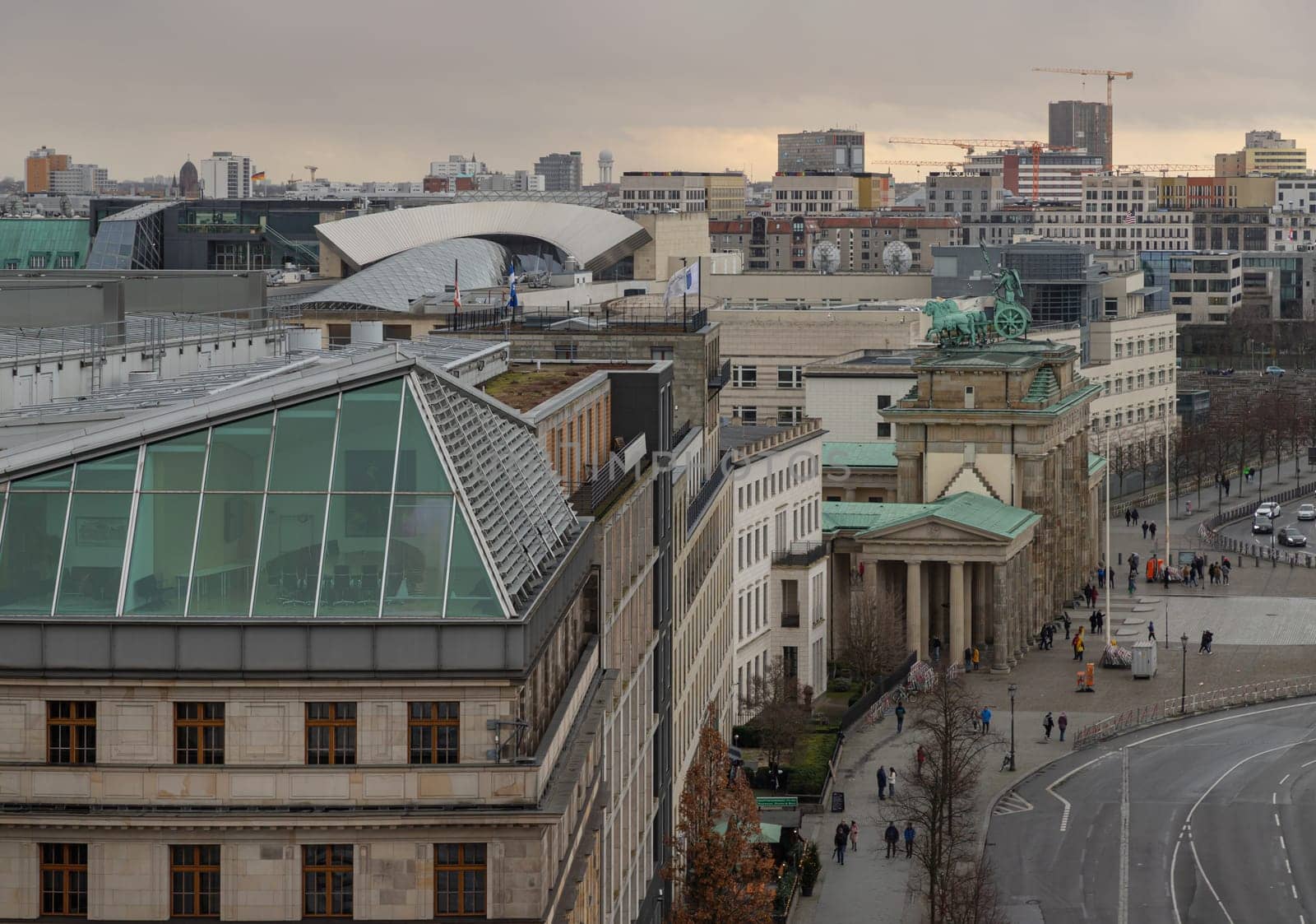 Berlin, Germany - Dec 20, 2023 - Berlin cityscape view with the Brandenburg Gate and the Eberstrasse from above of Reichstag building. a major tourist attraction of the berlin city, Copy space, Selective focus.