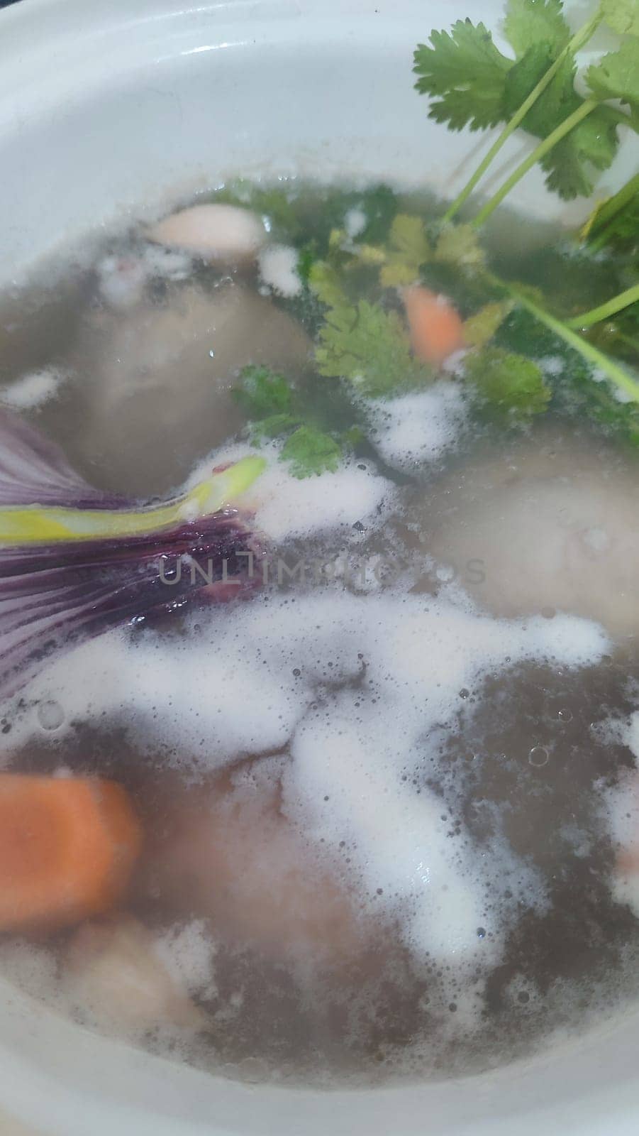 food, broth with carrots and parsley, soup. High quality photo