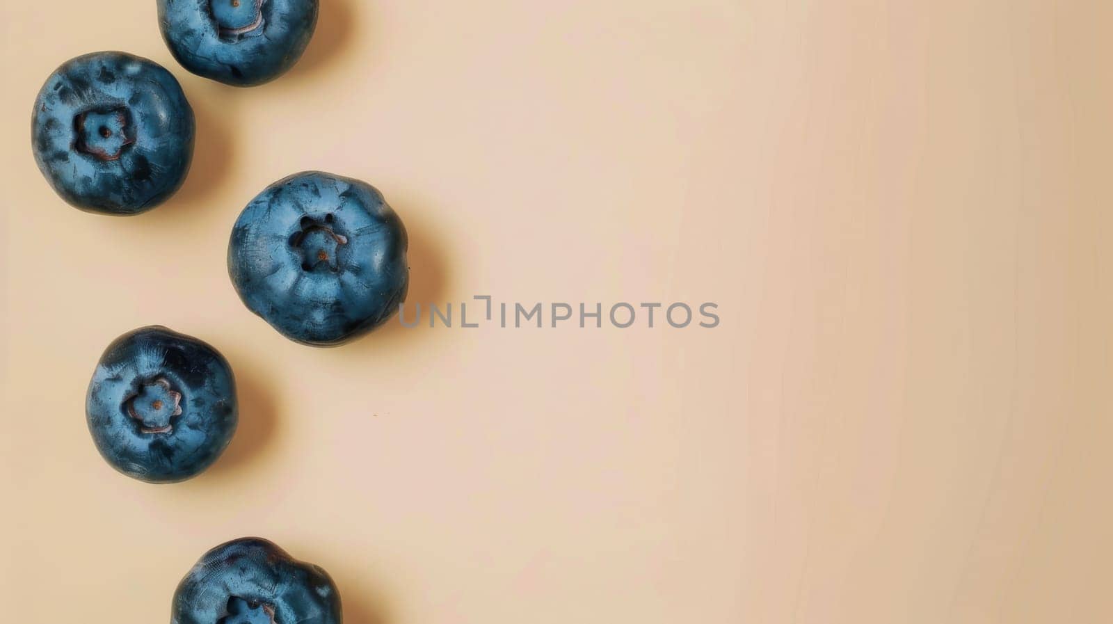 Blueberries on beige background, top view.