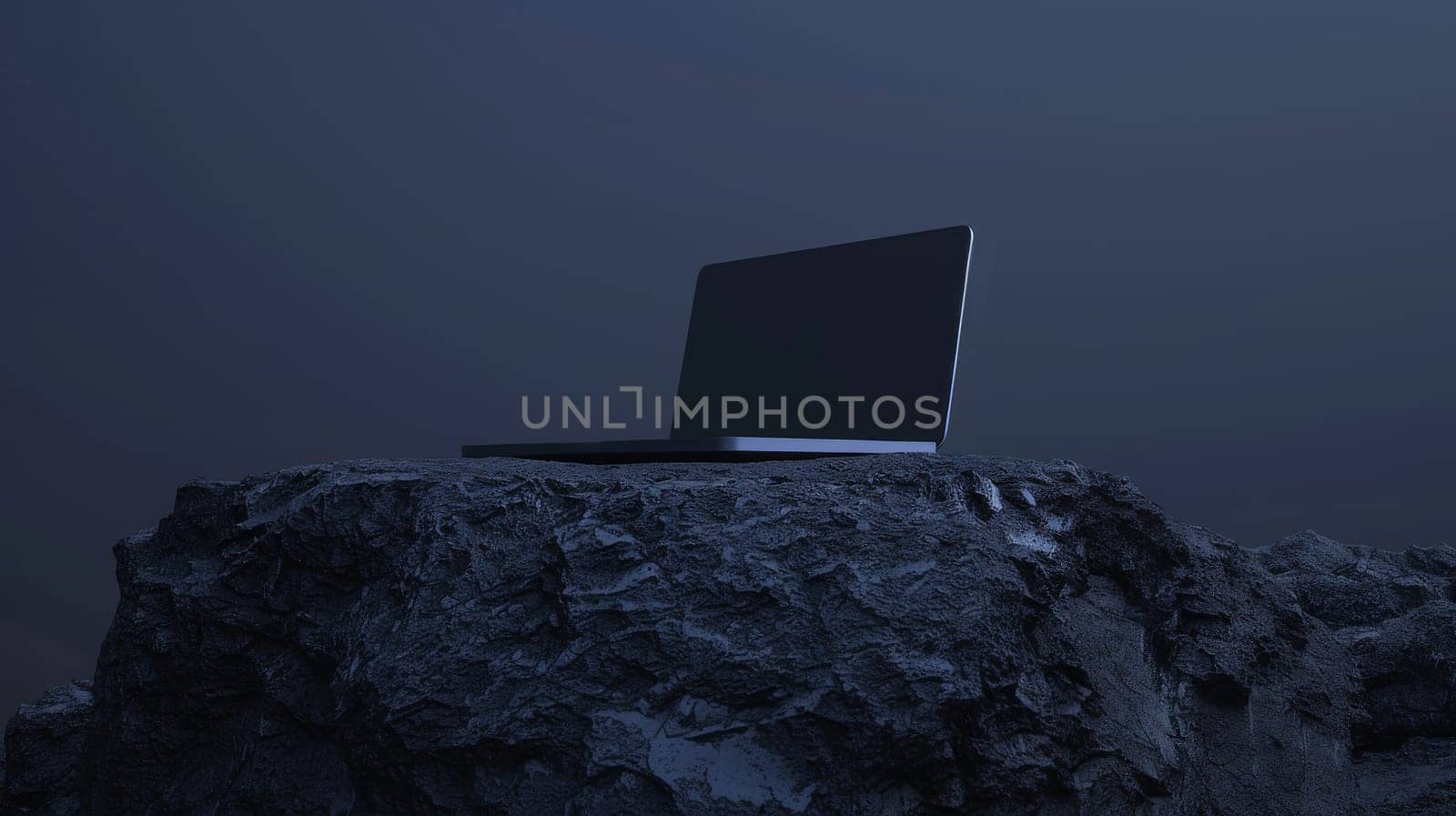 Laptop on a rocky surface in a dark, moody environment. Technology and adventure concept.