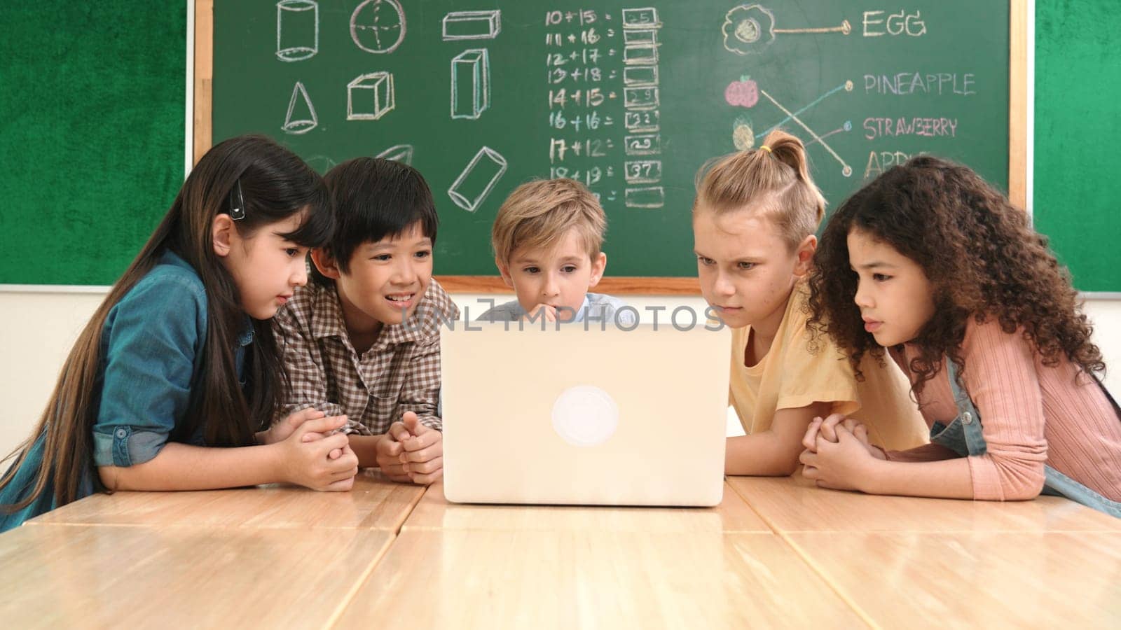 Top view diverse student looking at laptop and learning about coding engineering code and generating AI. Skilled children working together while brainstorm idea and planning creative plan. Pedagogy.