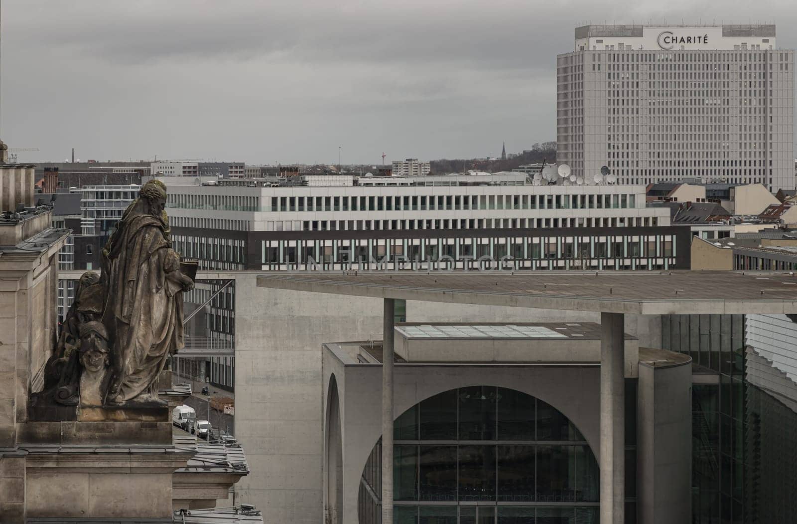 Berlin, Germany - Dec 20, 2023 - Berlin cityscape view from above of Reichstag building with Statue and Marie-Elisabeth-Lueders-Hau and buildings at the downtown Berlin. a major tourist attraction of the berlin city, Space for text, Selective focus.