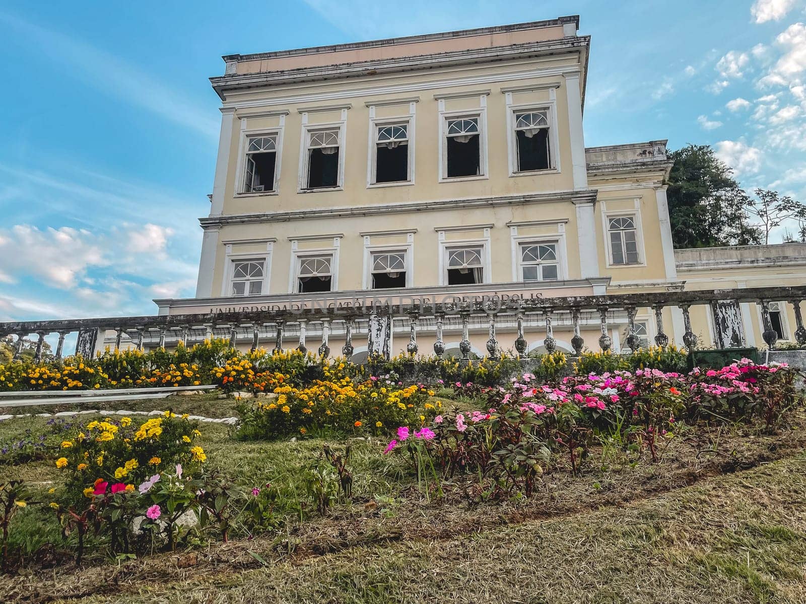 Flower Clock with the Catholic University in the background. Petropolis, Rio de Janeiro, Brazil. May 28, 2024.