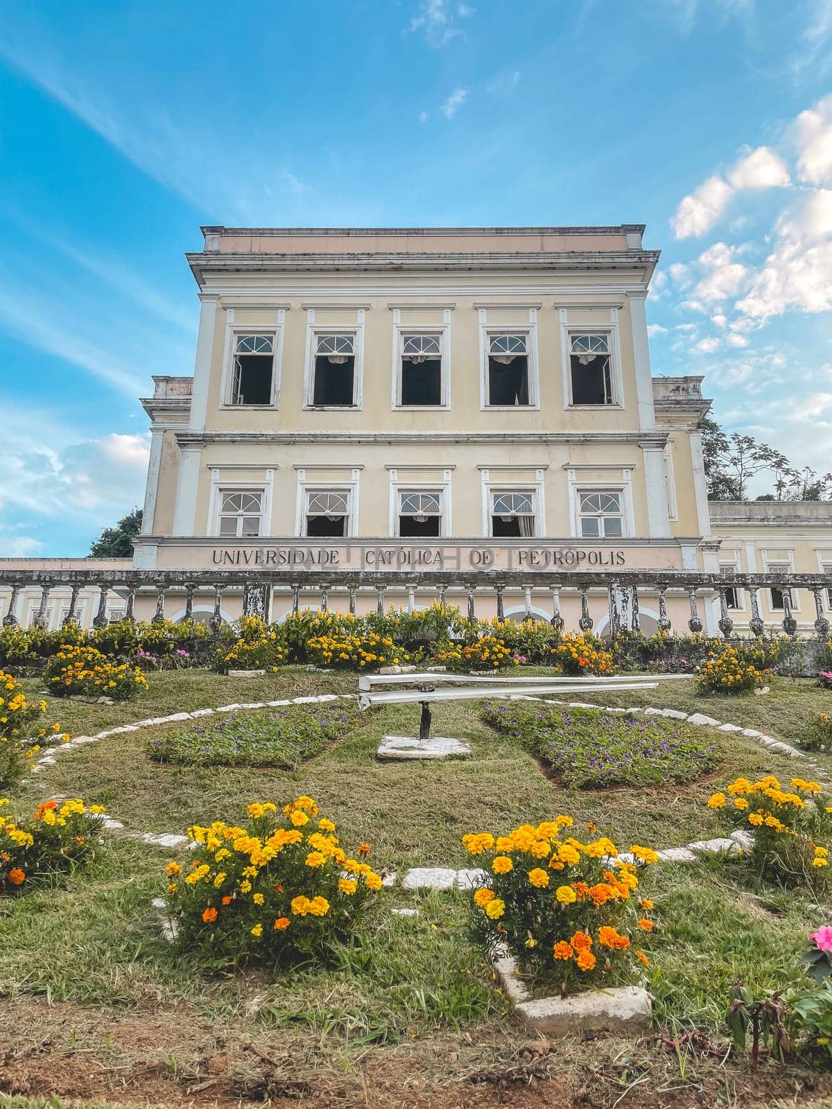 Flower Clock with the Catholic University in the background. Petropolis, Rio de Janeiro, Brazil. May 28, 2024.