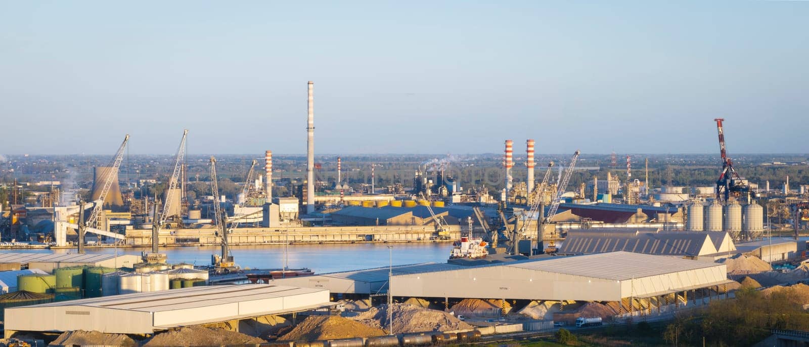 Aerial view of the industrial and port area of Ravenna ,chemical and petrochemical pole,thermoelectric,metallurgical plants and hydrocarbon refinery and liquefied natural gas tanks