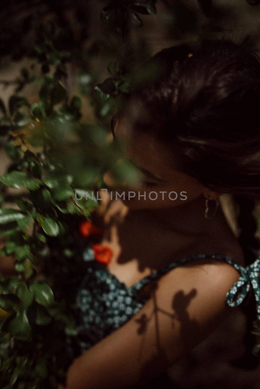 Artistic portrayal of a serene woman surrounded by greenery, capturing her natural beauty and ethereal essence