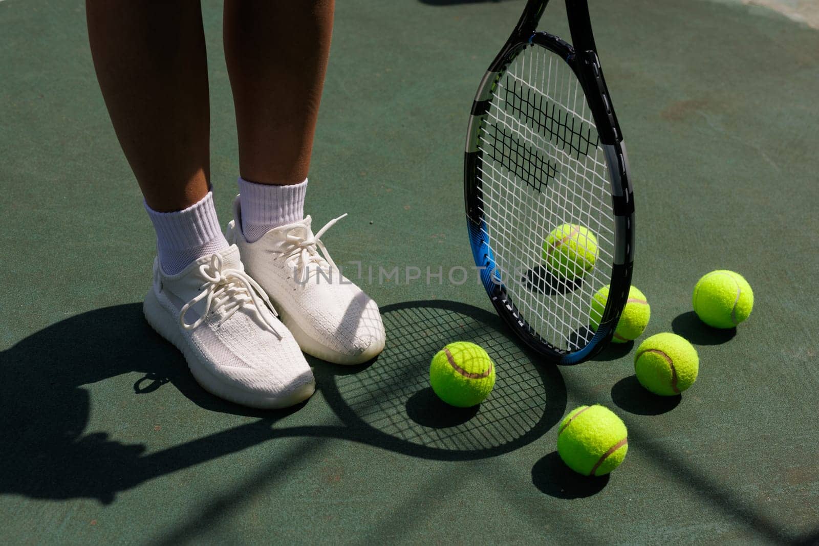 young woman playing tennis on the tennis court, olympic sport by SergiiKolesnikov