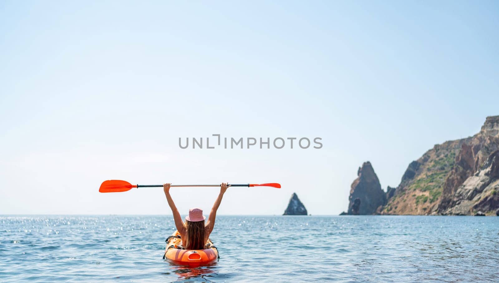 Kayak sea woman. Happy attractive woman with long hair in red swimsuit, swimming on kayak. Summer holiday vacation and travel concept. by Matiunina