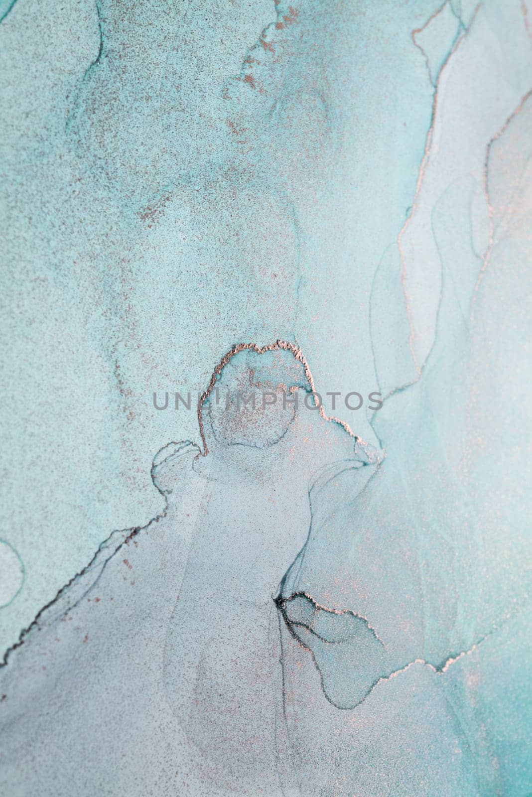 A close-up abstract art piece featuring swirling teal and silver paint. The image captures the intricate details of the paint mixing and blending, creating a unique and captivating visual.