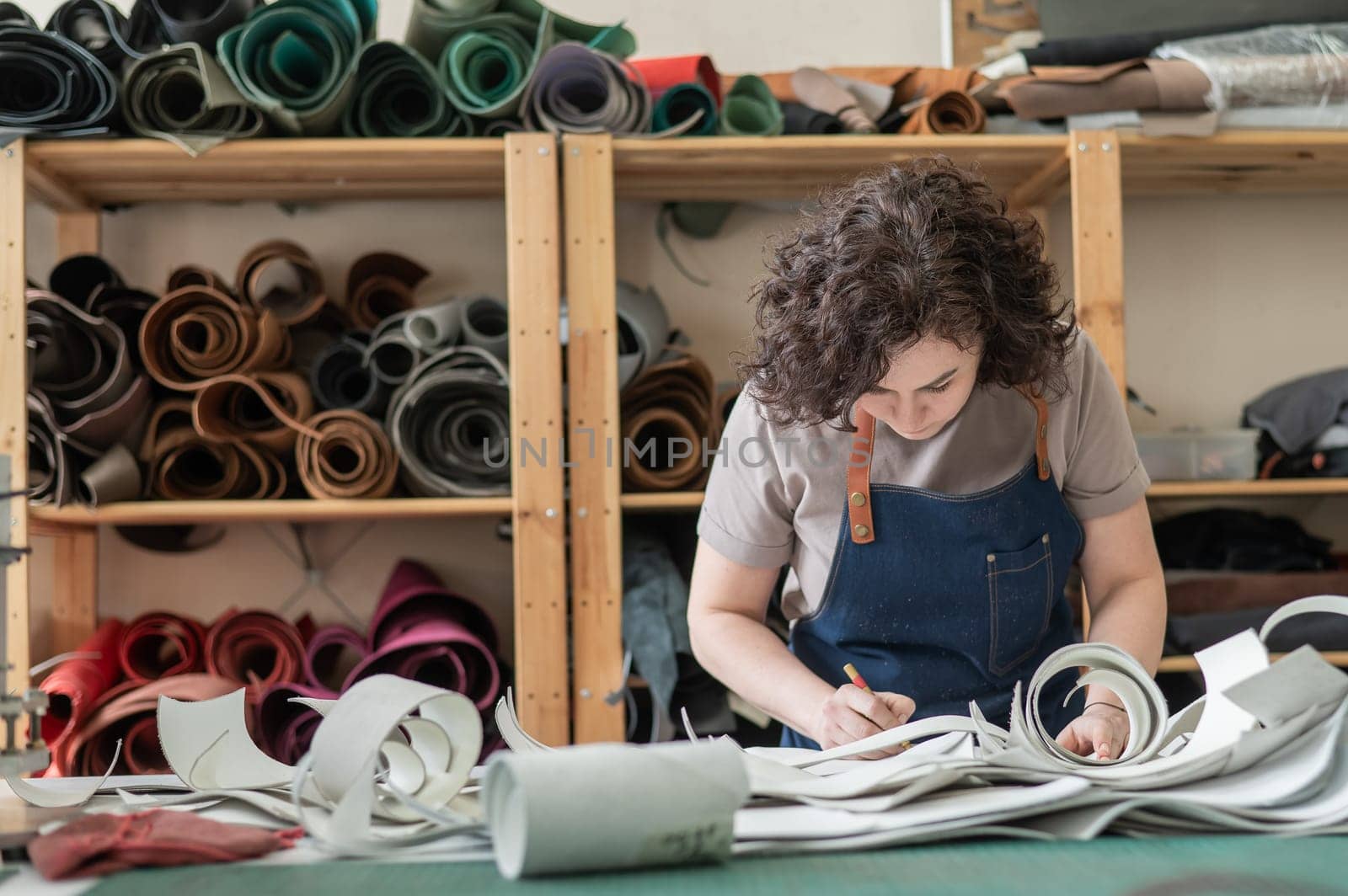 Woman tanner at work in the workshop