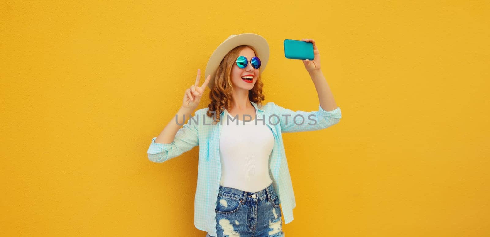 Joyful happy young woman laugh taking selfie with phone, modern cheerful girl in summer tourist hat by Rohappy