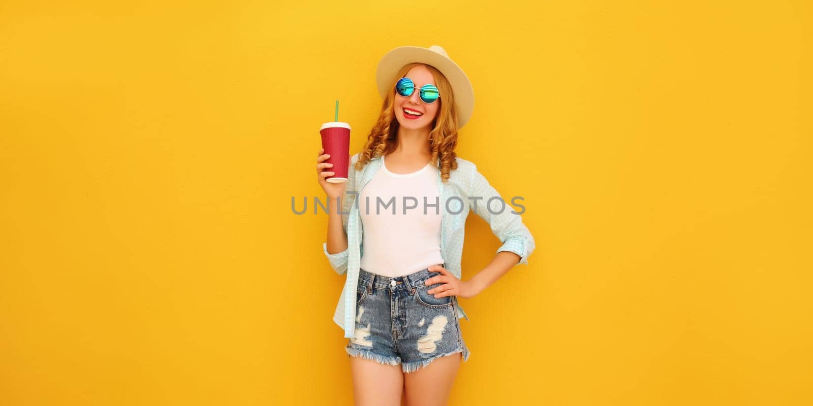 Summer joyful young woman with cup of coffee, stylish modern girl holds juice in tourist hat by Rohappy