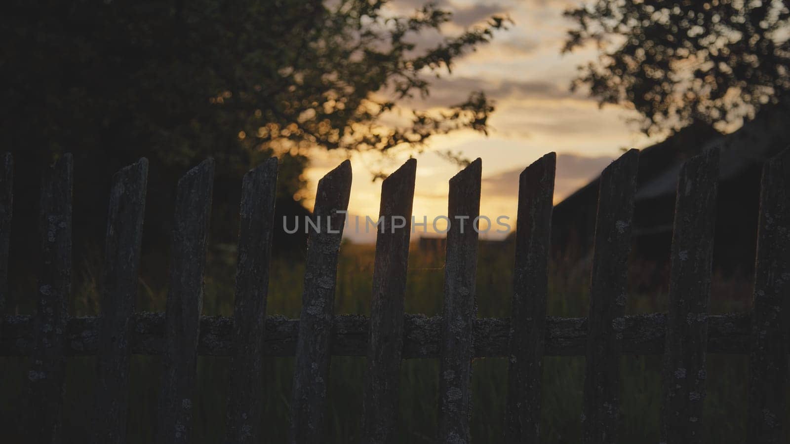 A rustic fence at sunset. by DovidPro