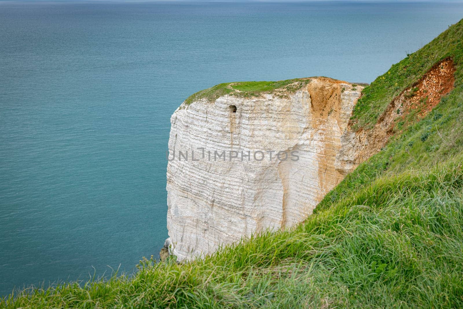 le treport with the big cliffs and green fields with the sea as background