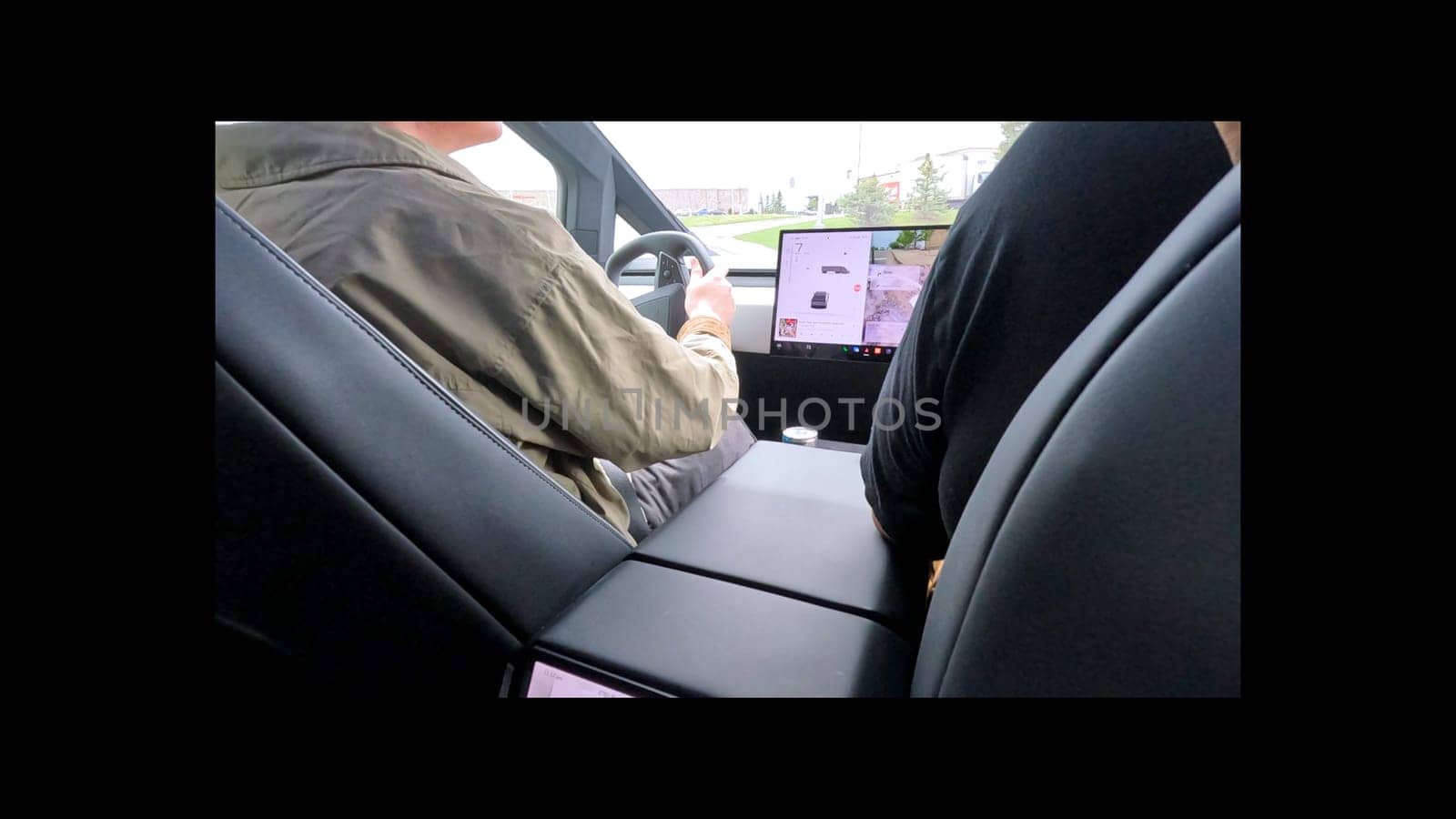 Denver, Colorado, USA-June 11, 2024-Slow motion-The interior view of a Tesla Cybertruck, showcasing its advanced dashboard and rear-seat screen. The modern and sleek design emphasizes Tesla innovative technology and luxury features.