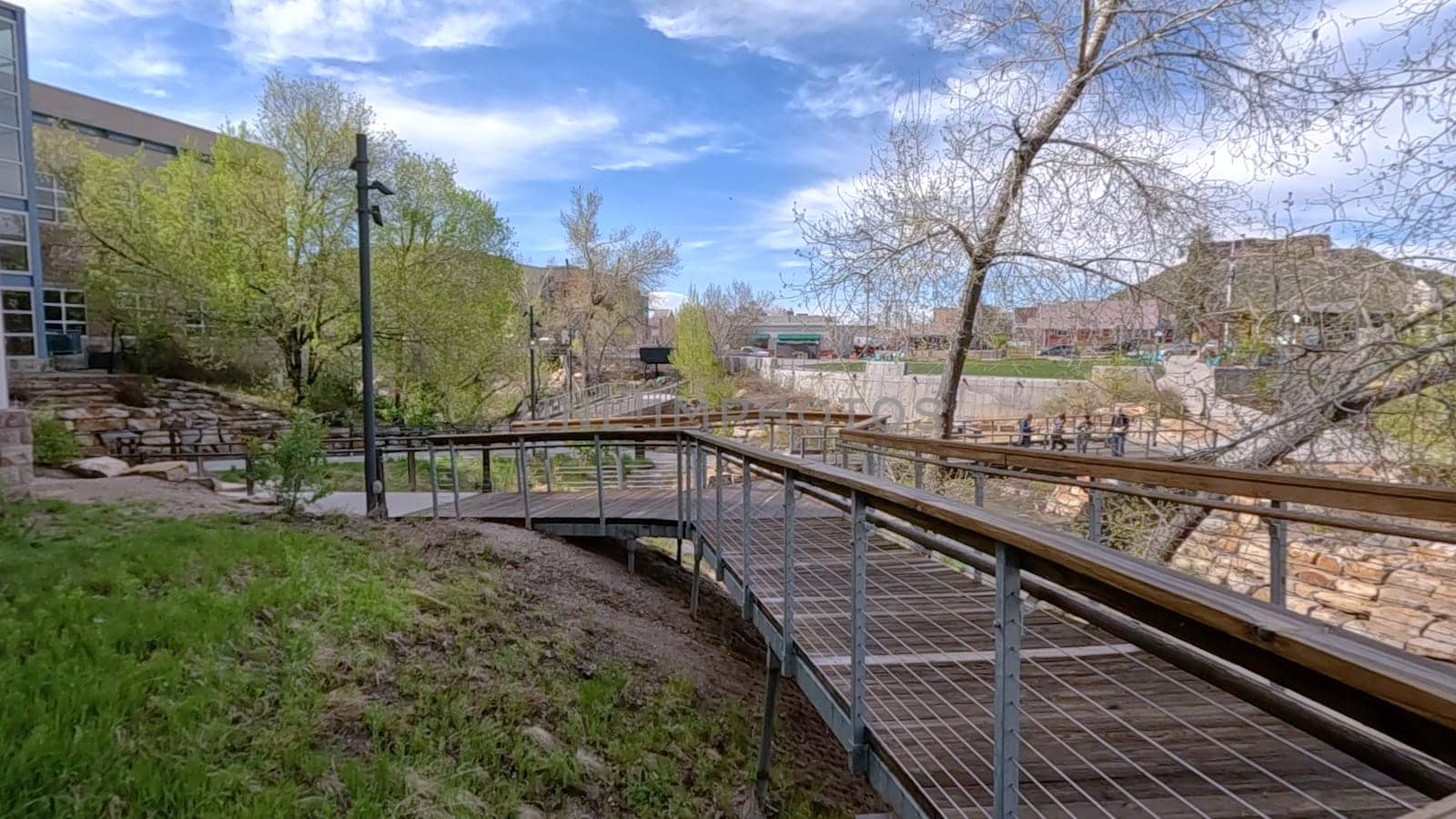 Picturesque View of Downtown Castle Rock, Colorado with Serene River and Modern Buildings by arinahabich