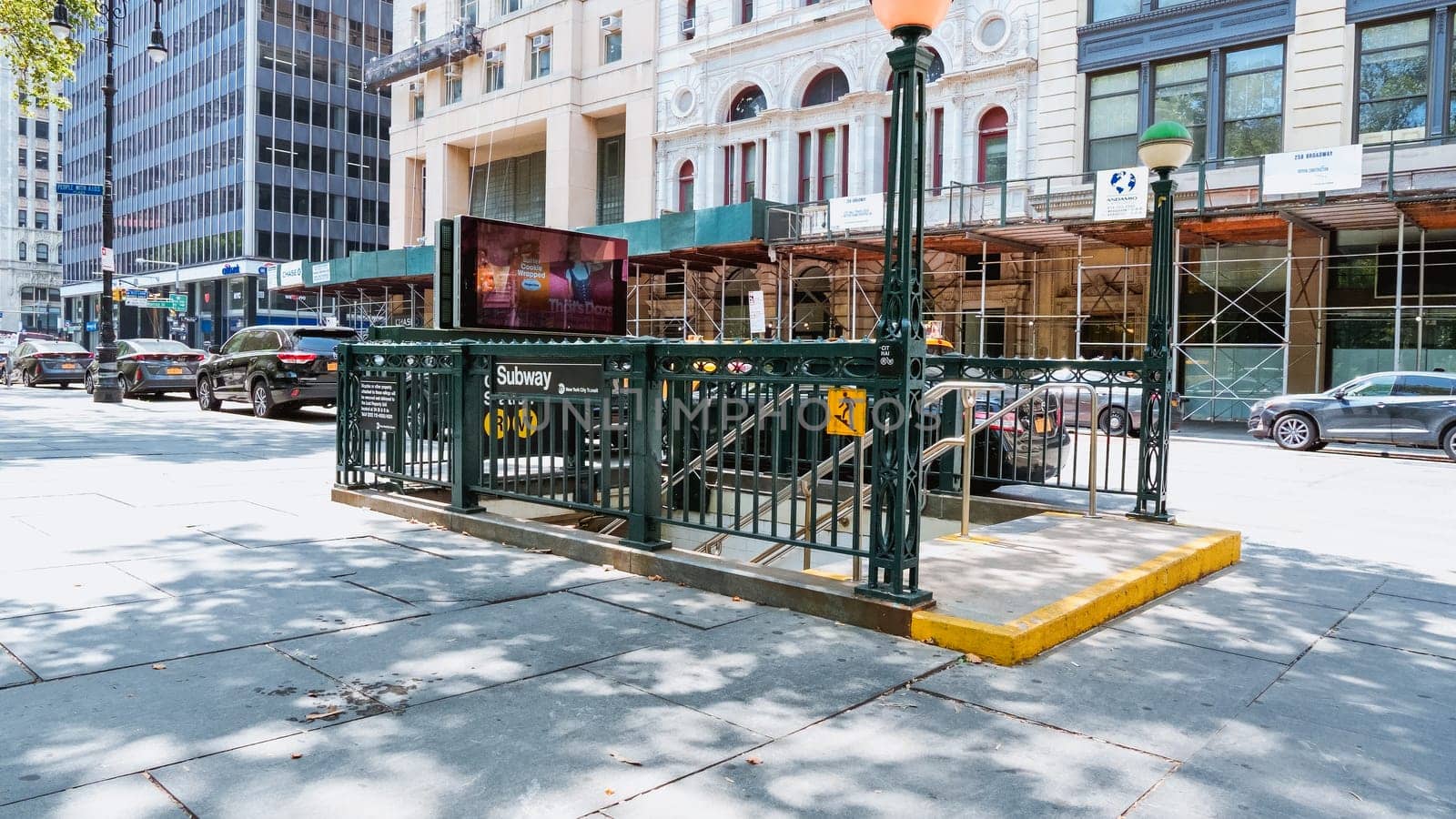 City Subway Station Kiosk on a Busy Urban Street Corner with Passing Cars and Pedestrians New York NY USA 2023-07-30 by JuliaDorian