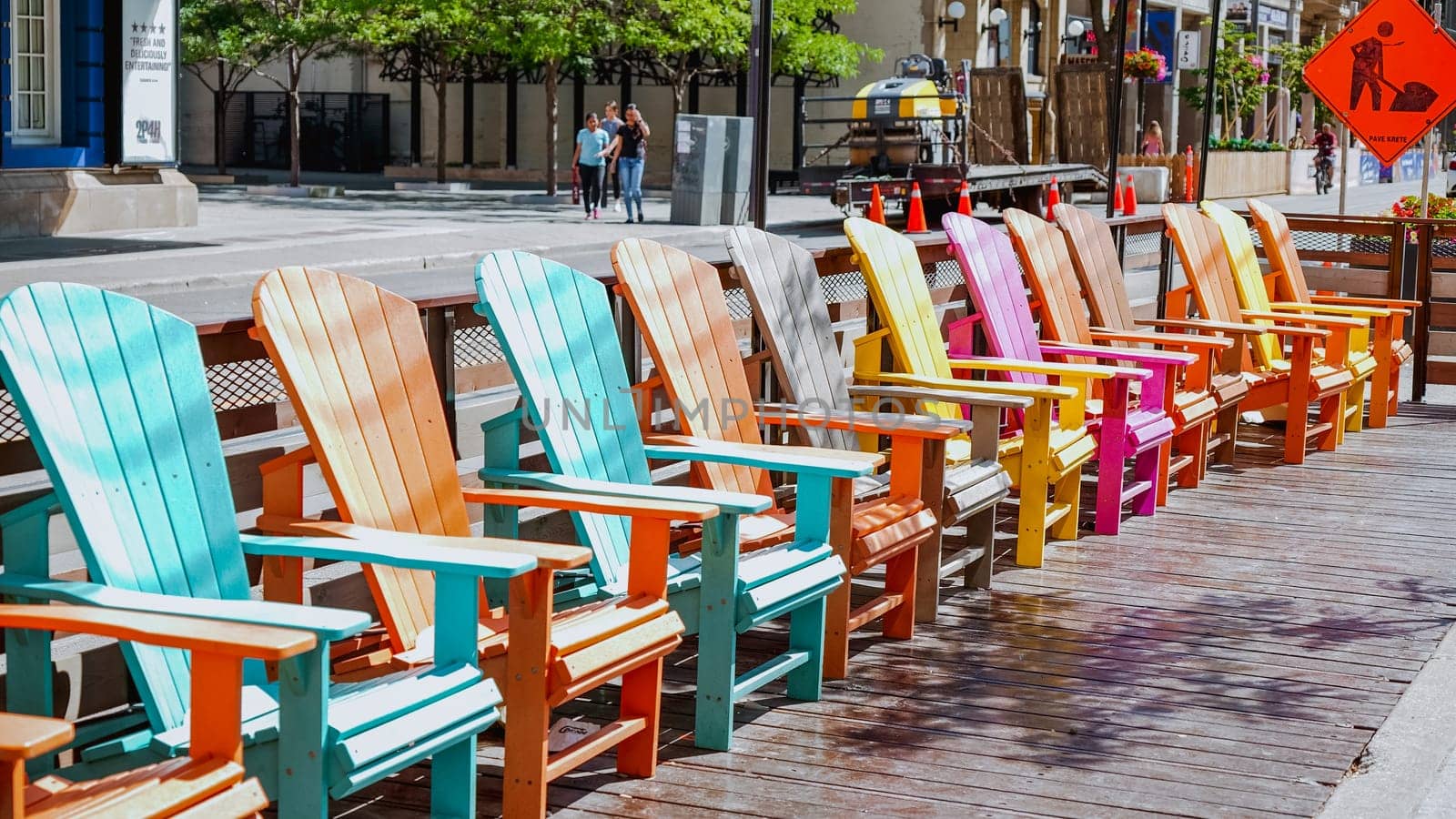 Colorful chairs on King street in front of International Film Festival building. Toronto, Canada - July 4, 2022.