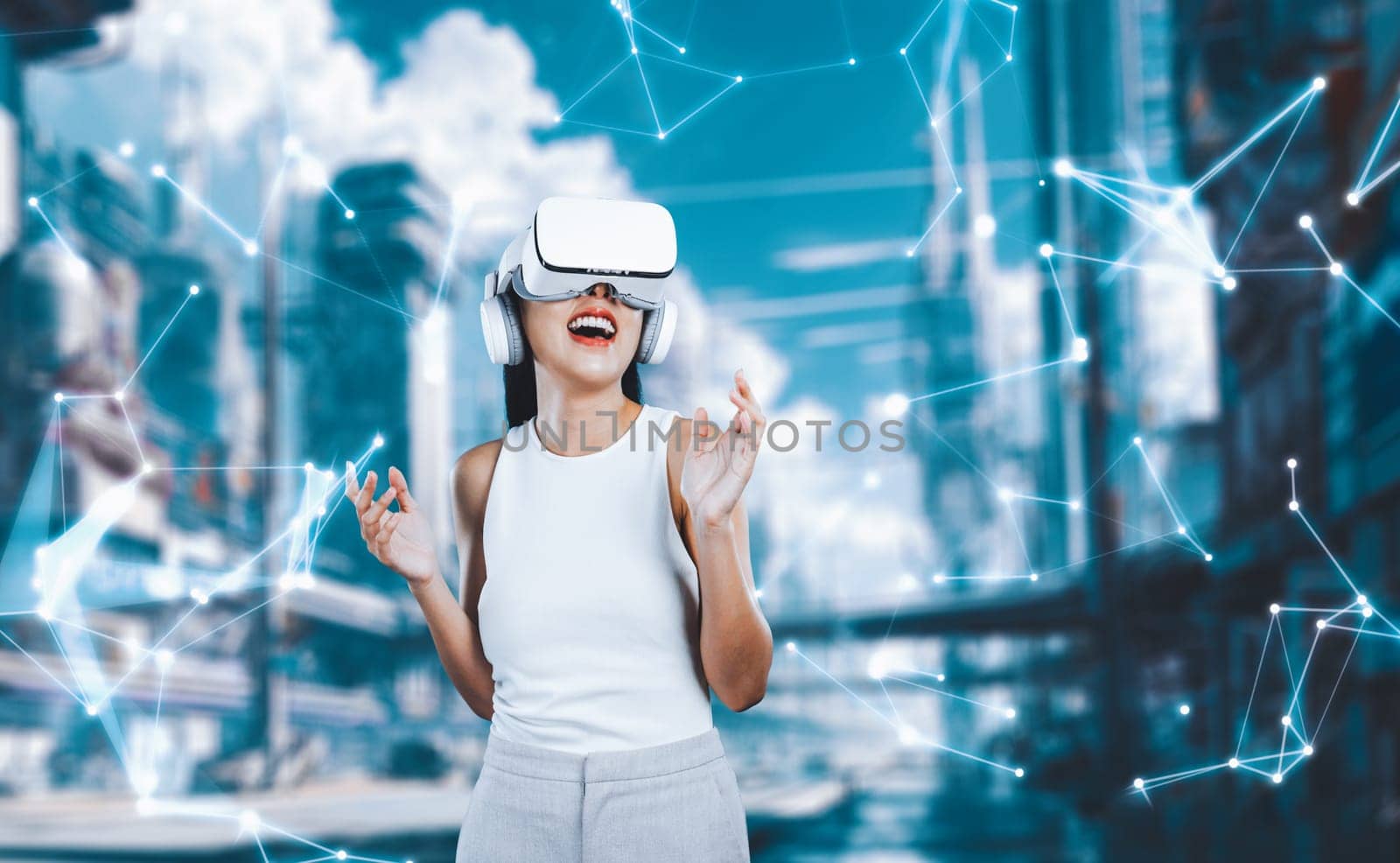 Female stand wear white VR headset and white sleeveless connect metaverse, future technology create cyberspace community. She look around and gesticulate enjoy fantasy building in meta. Hallucination.