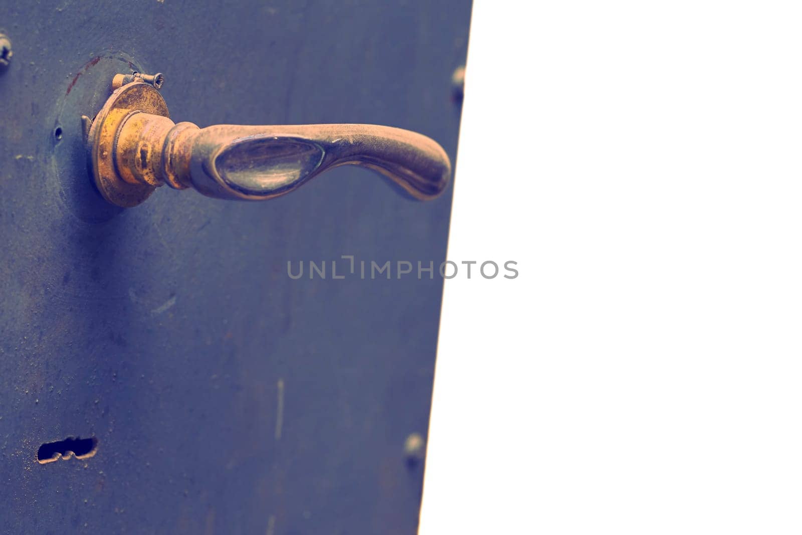 Copper brass handle on a metal gray blue door.Place for text by jovani68