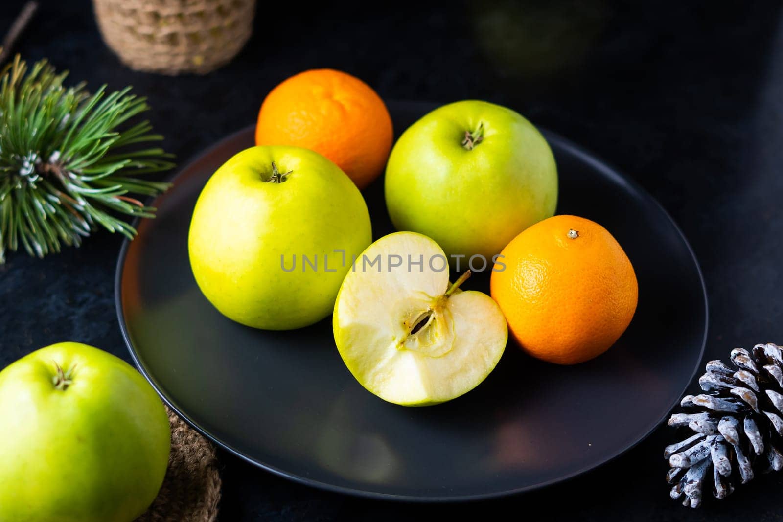 Fresh ripe green apples on wooden table against dark background, space for text by Zelenin