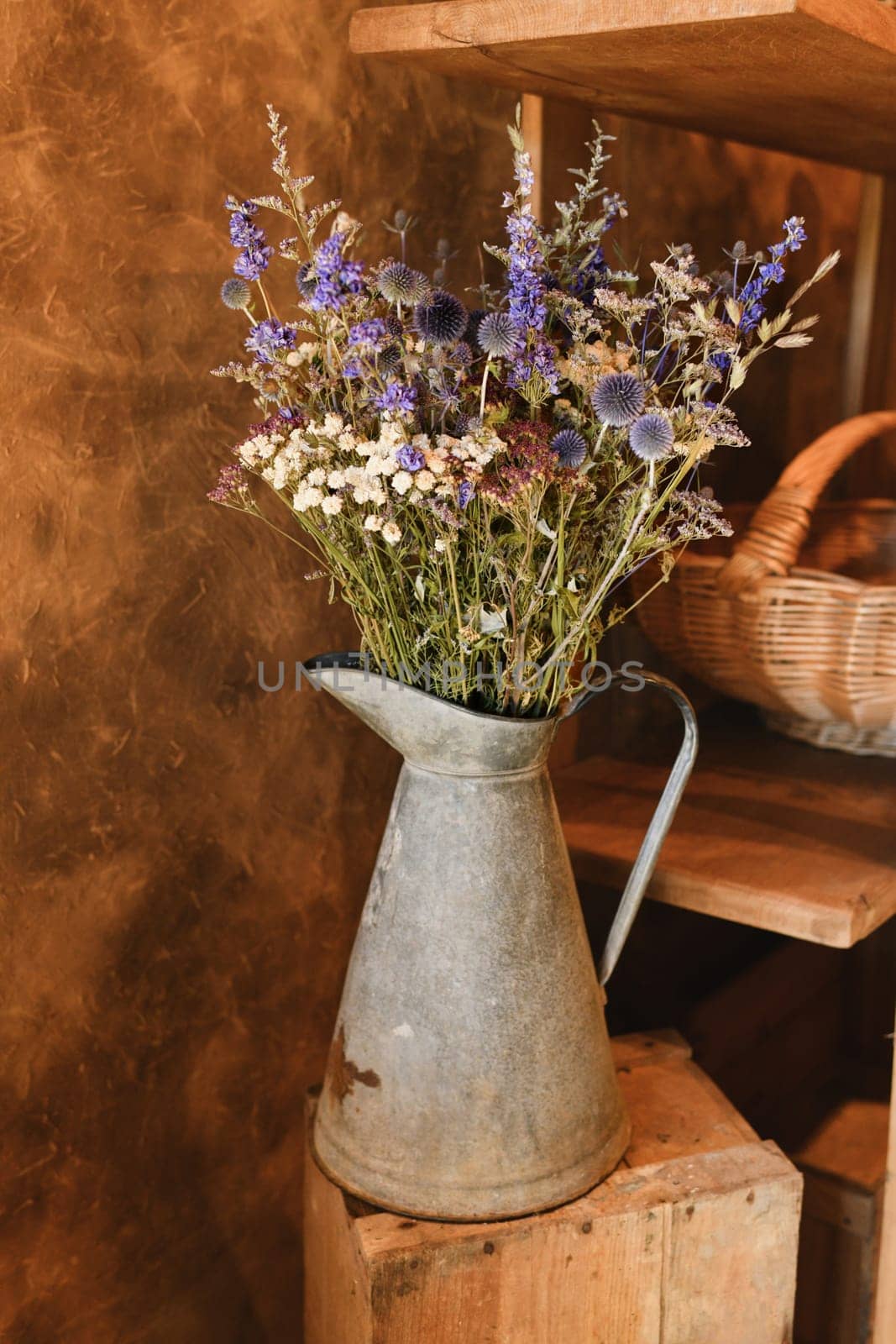 bouquet of dried flowers in a pink vase Azurite