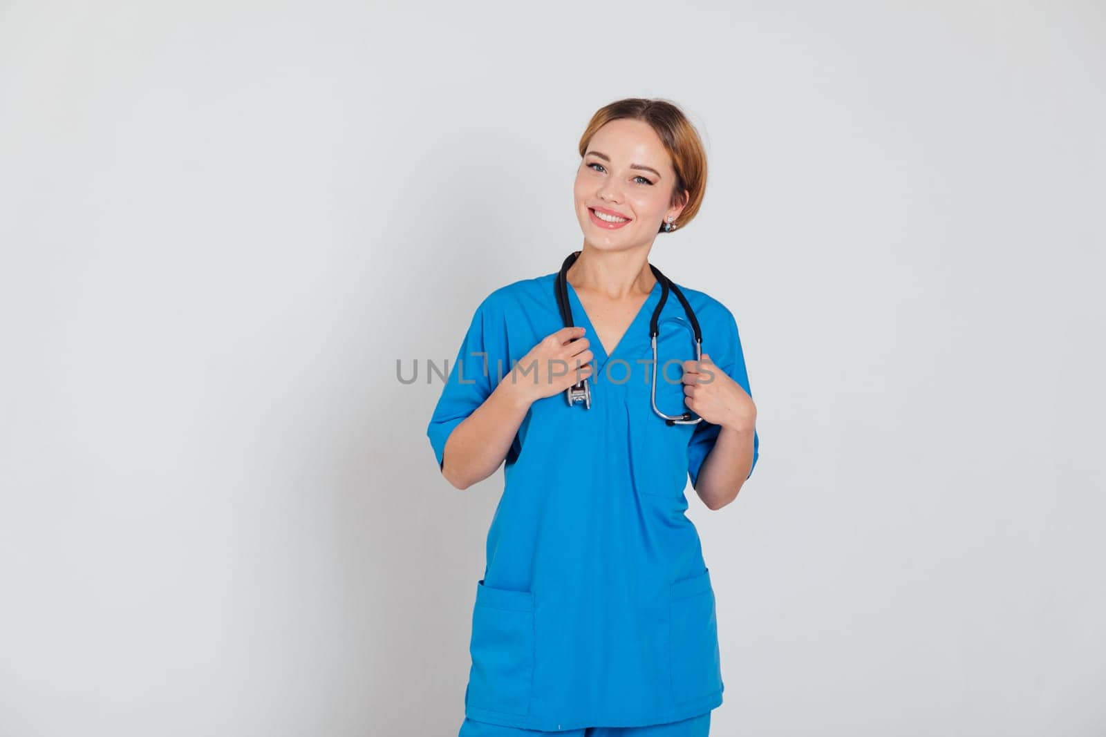 a female doctor in blue suit with phonendoscope stethoscope in hospital hospital