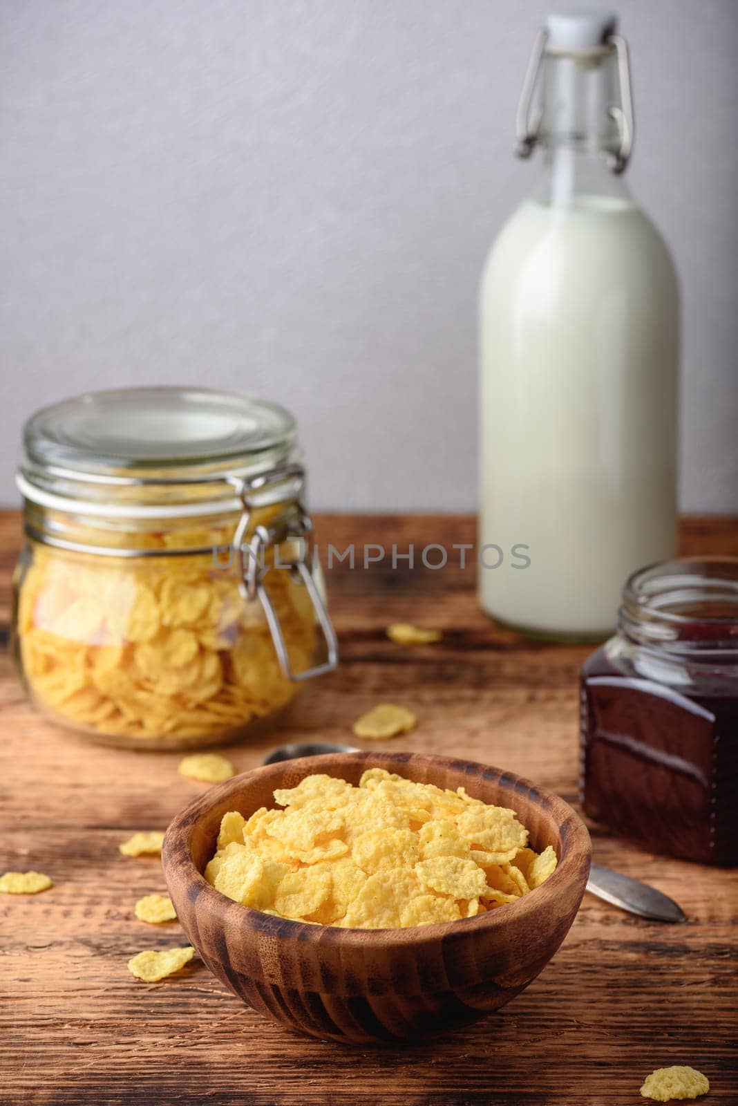 Breakfast with corn flakes, milk and jam by Seva_blsv