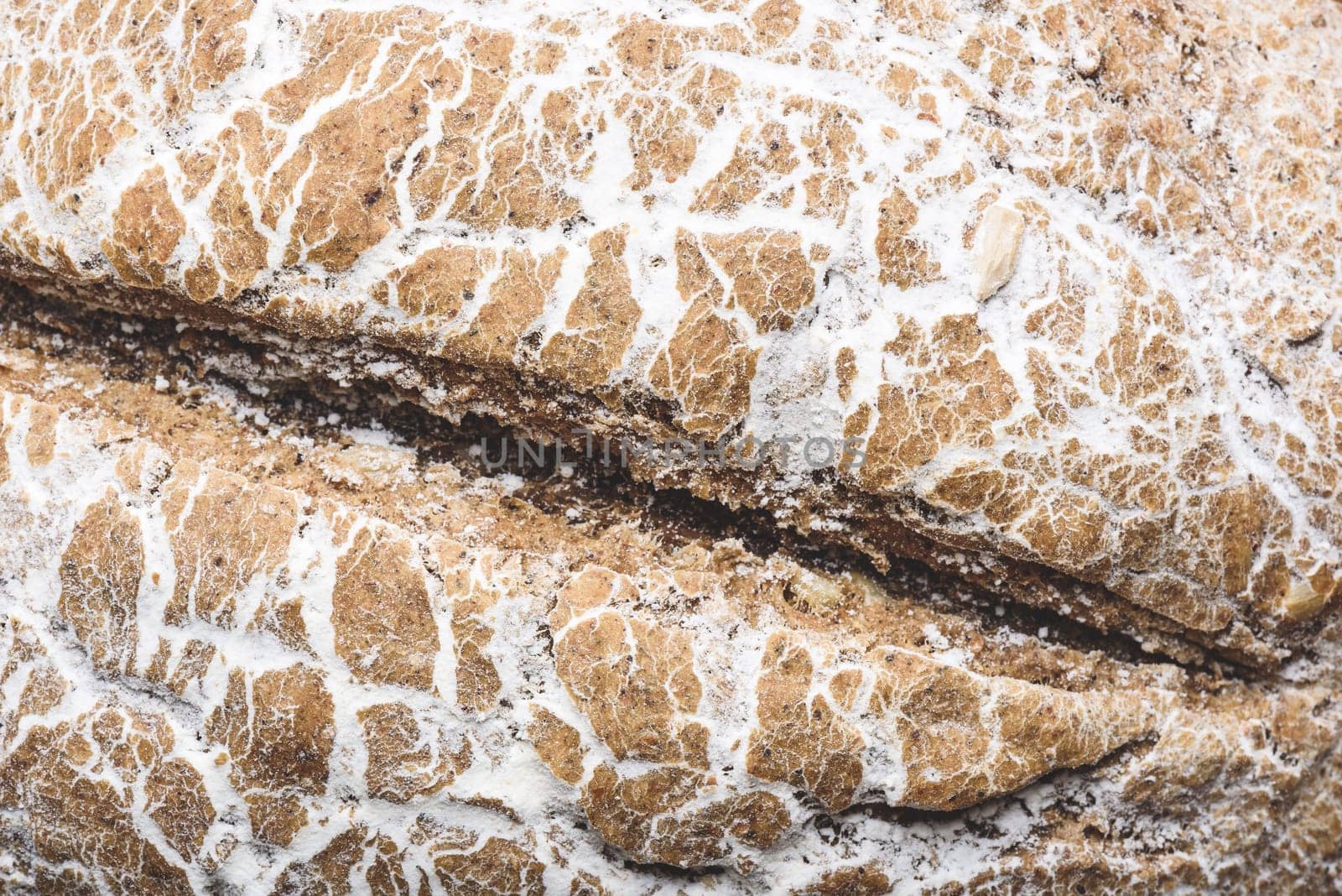 Background of freshly baked loaf of rye bread