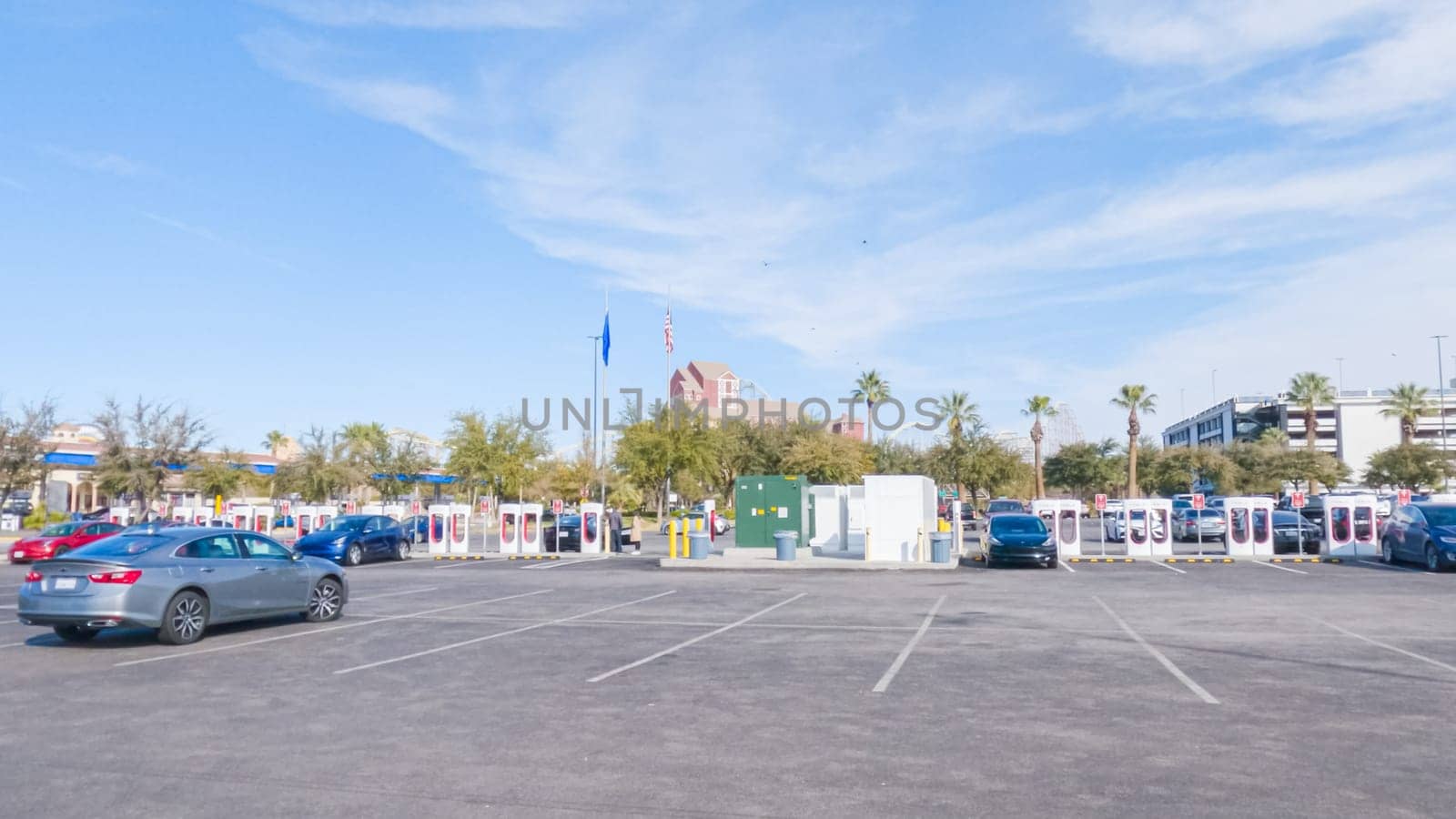 Primm, Nevada, USA-December 3, 2022-During the day, a Tesla vehicle is seen charging at a Tesla Supercharging station, utilizing the high-speed charging infrastructure for convenient and efficient electric vehicle refueling.