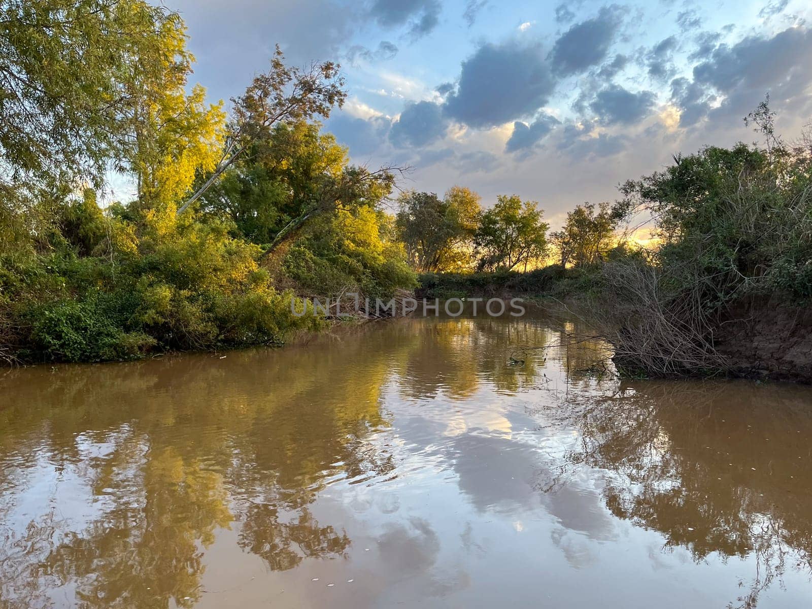 The arm of the Rio Prana near Rosario, sunny afternoon. Horizontal photo.wallpaper. Space for text. Banner for tourist promotion