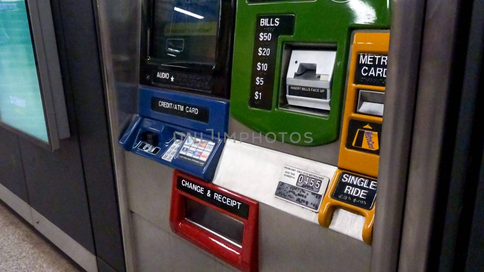 Blue ATM card reader with a slot for inserting a card and a numeric keypad New York NY USA 2023-07-30.