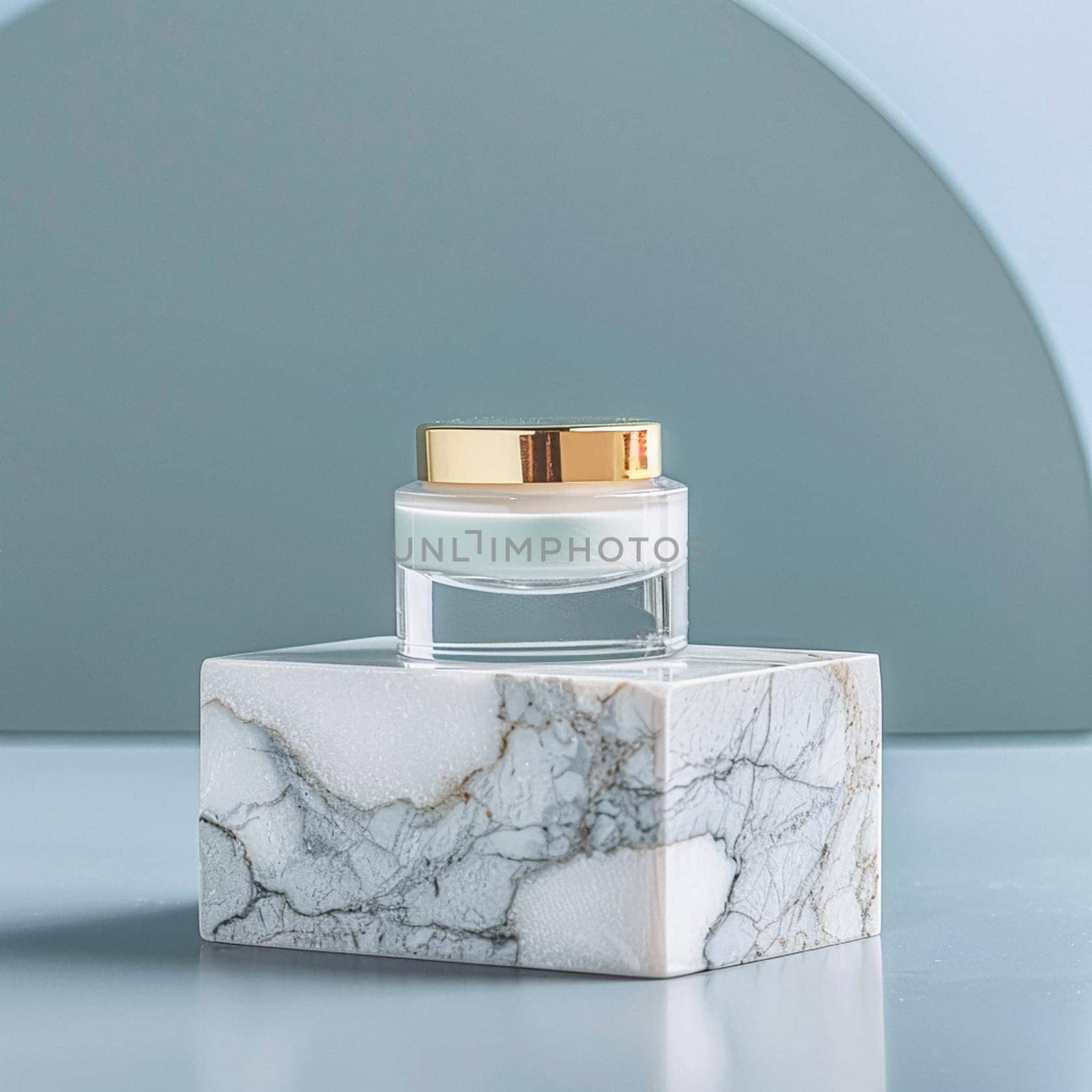 Cosmetic cream in a glass jar on a blue backdrop. Skin care concept. Background for beauty products