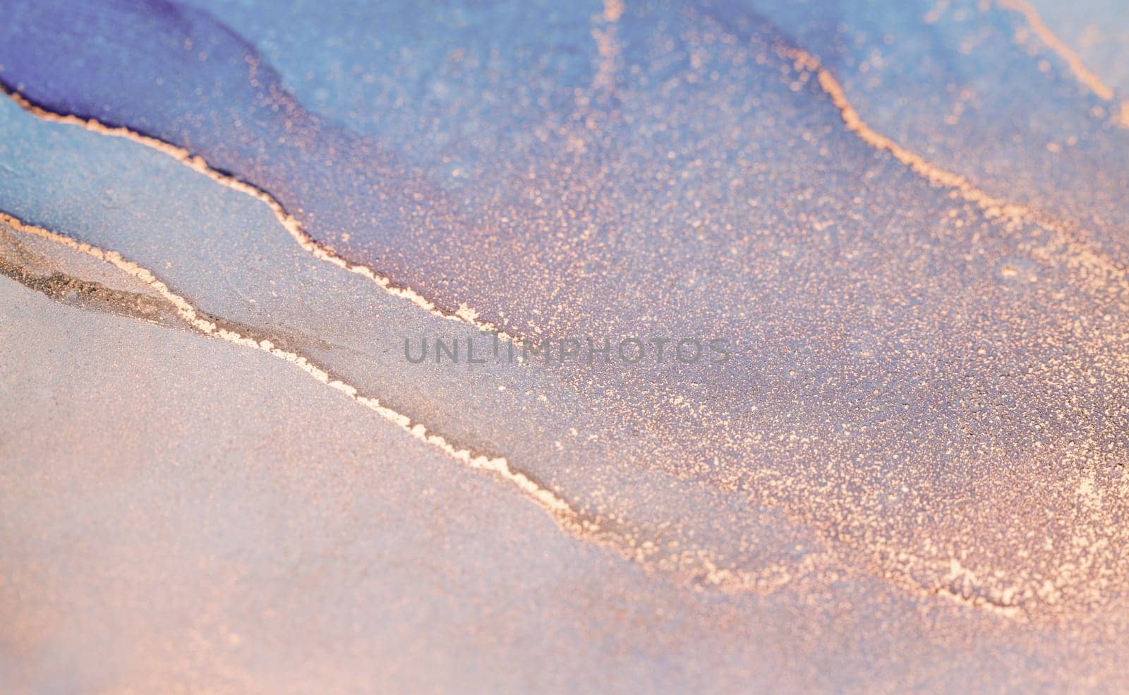 Close-up of swirling abstract art with blue, pink hues, and golden shimmer. Detailed image with delicate gold veins traversing the surface.