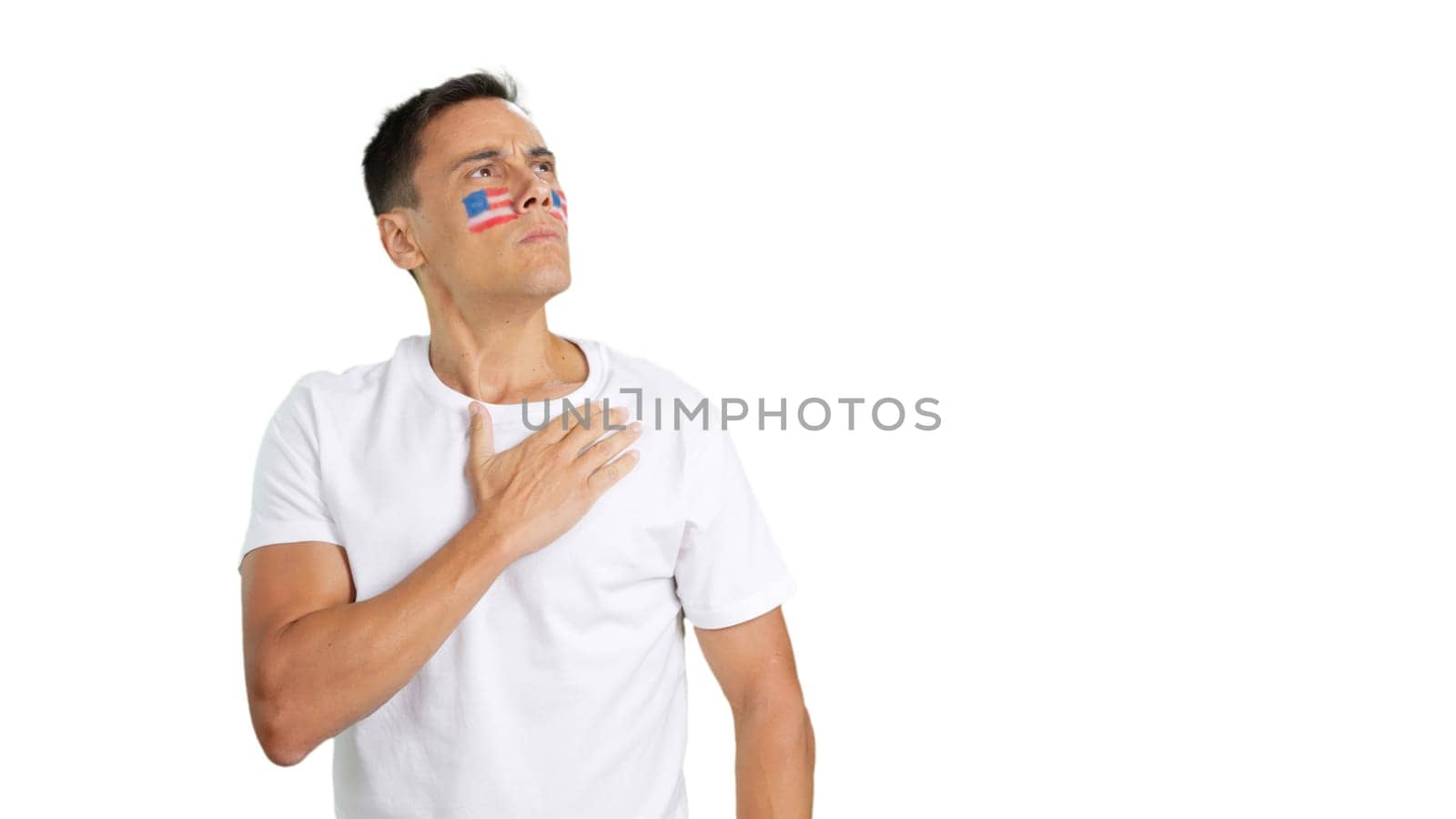 USA patriot listening to the national anthem with solemnity