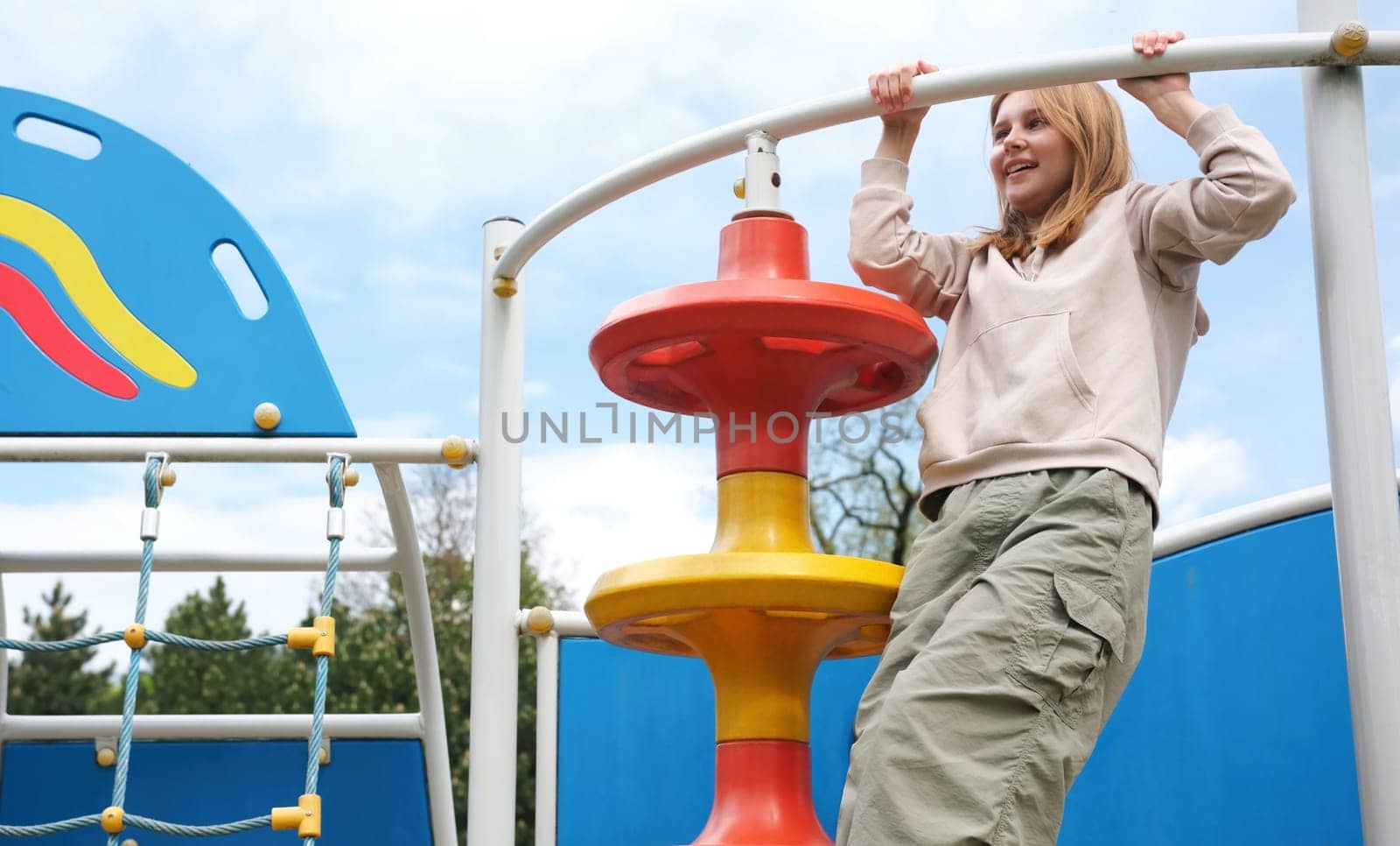 Adorable Young Girl Having Fun At A Park Playground After School