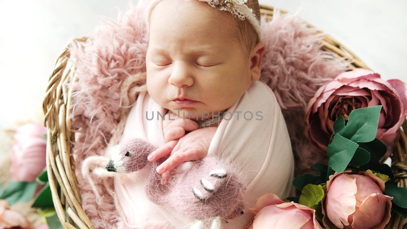 Cute Newborn Baby Girl Swaddled In A Blanket