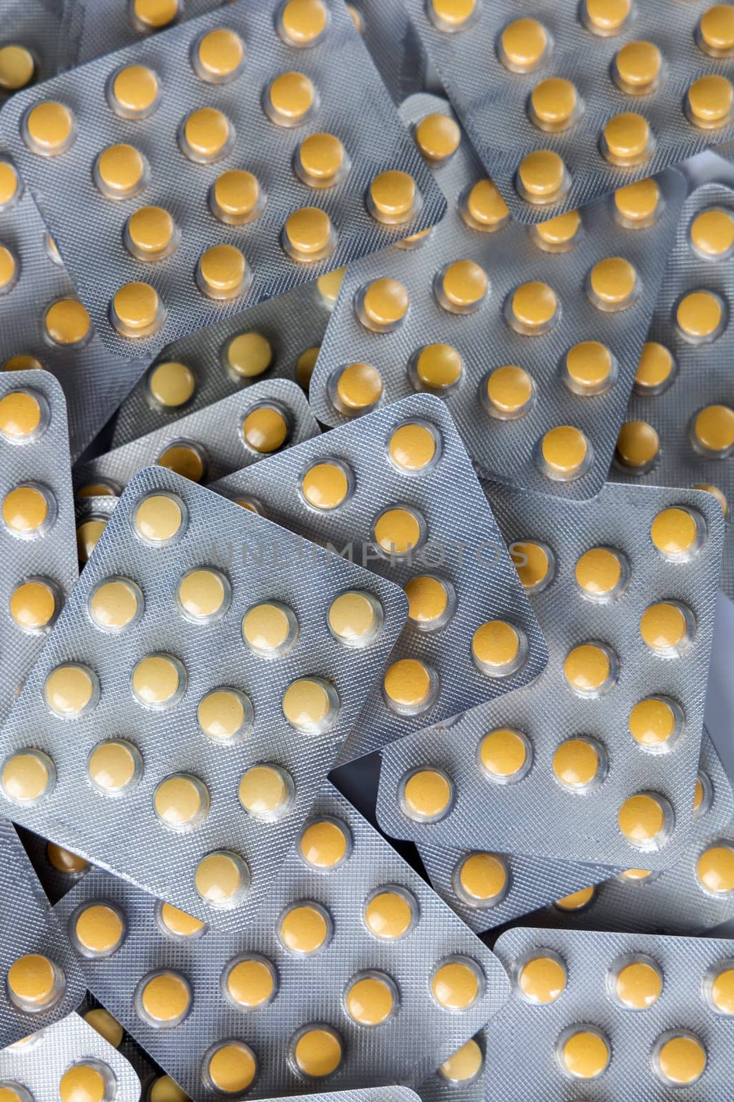 A lot of yellow pills packs. Pharmaceutical medicine pills. High quality photo