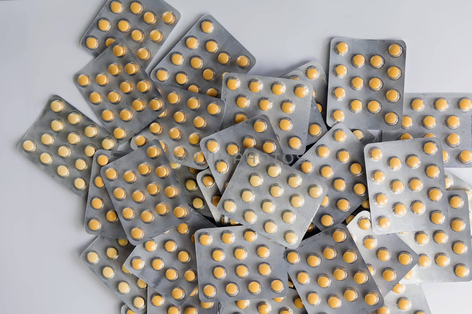 A lot of yellow pills packs. Pharmaceutical medicine pills. High quality photo