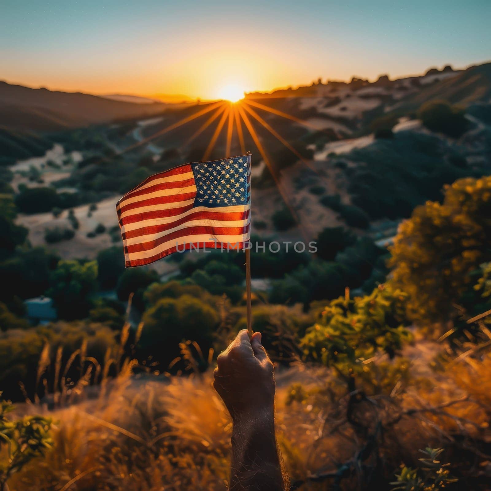 Focused image of a hand proudly holding a flag, of America is Independence Day