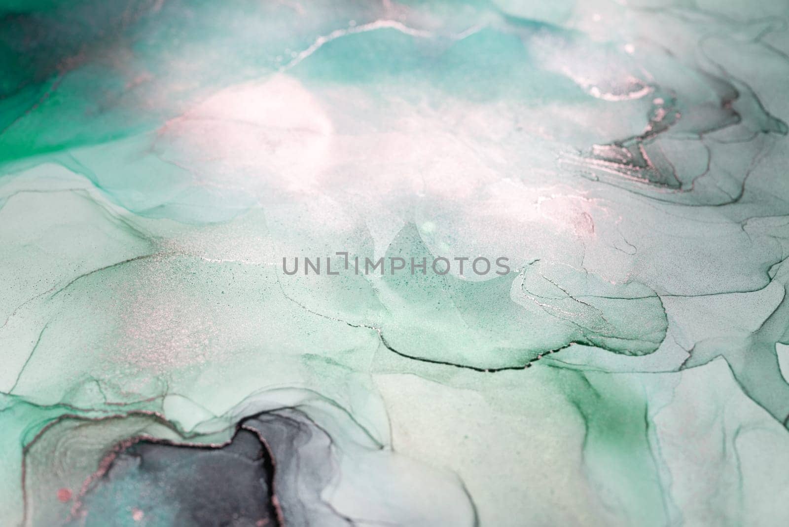 An abstract painting featuring flowing, swirling teal and silver ink. The artwork creates a sense of depth and movement, with light and dark areas intermingling.