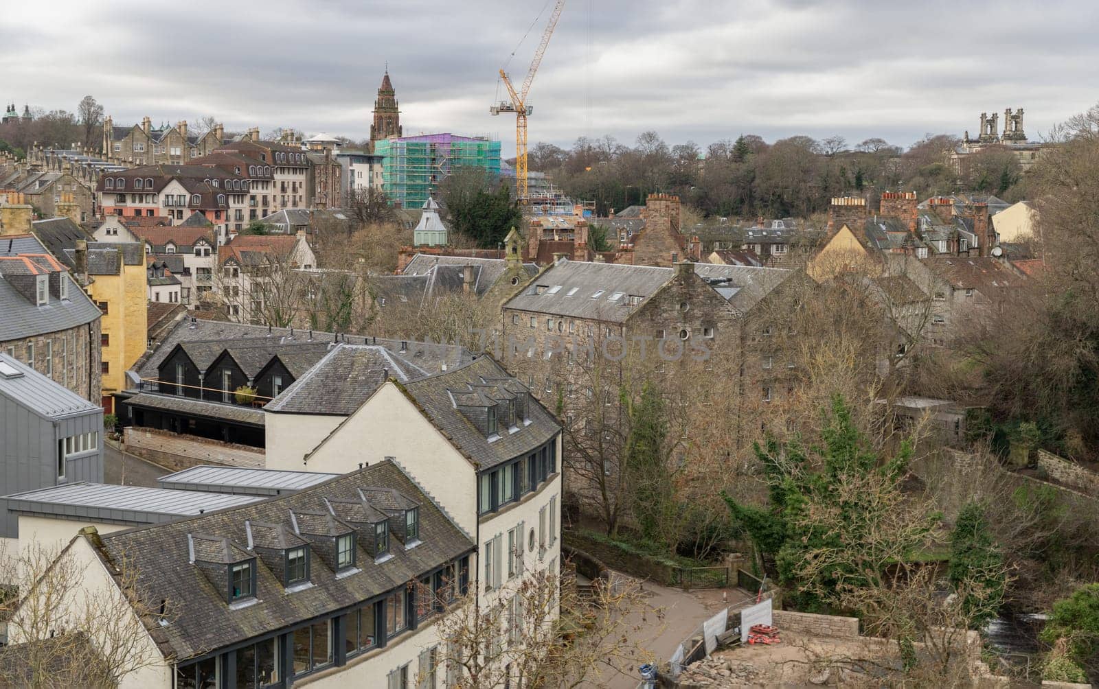 Edinburgh, Scotland - Jan 16, 2024 - Picturesque view of Dean Village on the Water and Leith from the Dean Bridge. Historic village and Beautiful scenery view, Amazing Edinburgh cityscape, Destinations in Europe, Space for text, Selective focus.