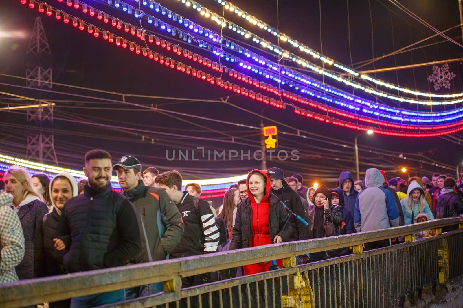 crowd of Russian people crossing the bridge after watching fireworks at the celebration of victory day by z1b