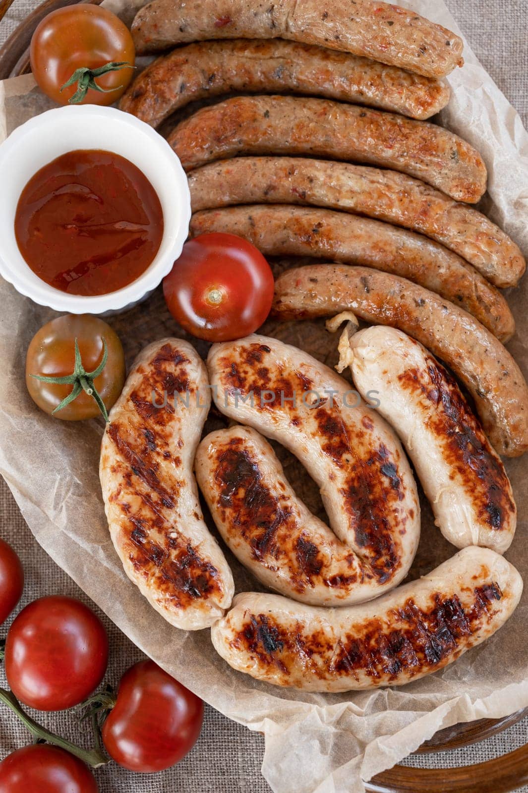 Grilled sausages with sauce and vegetables. Summer rest concept