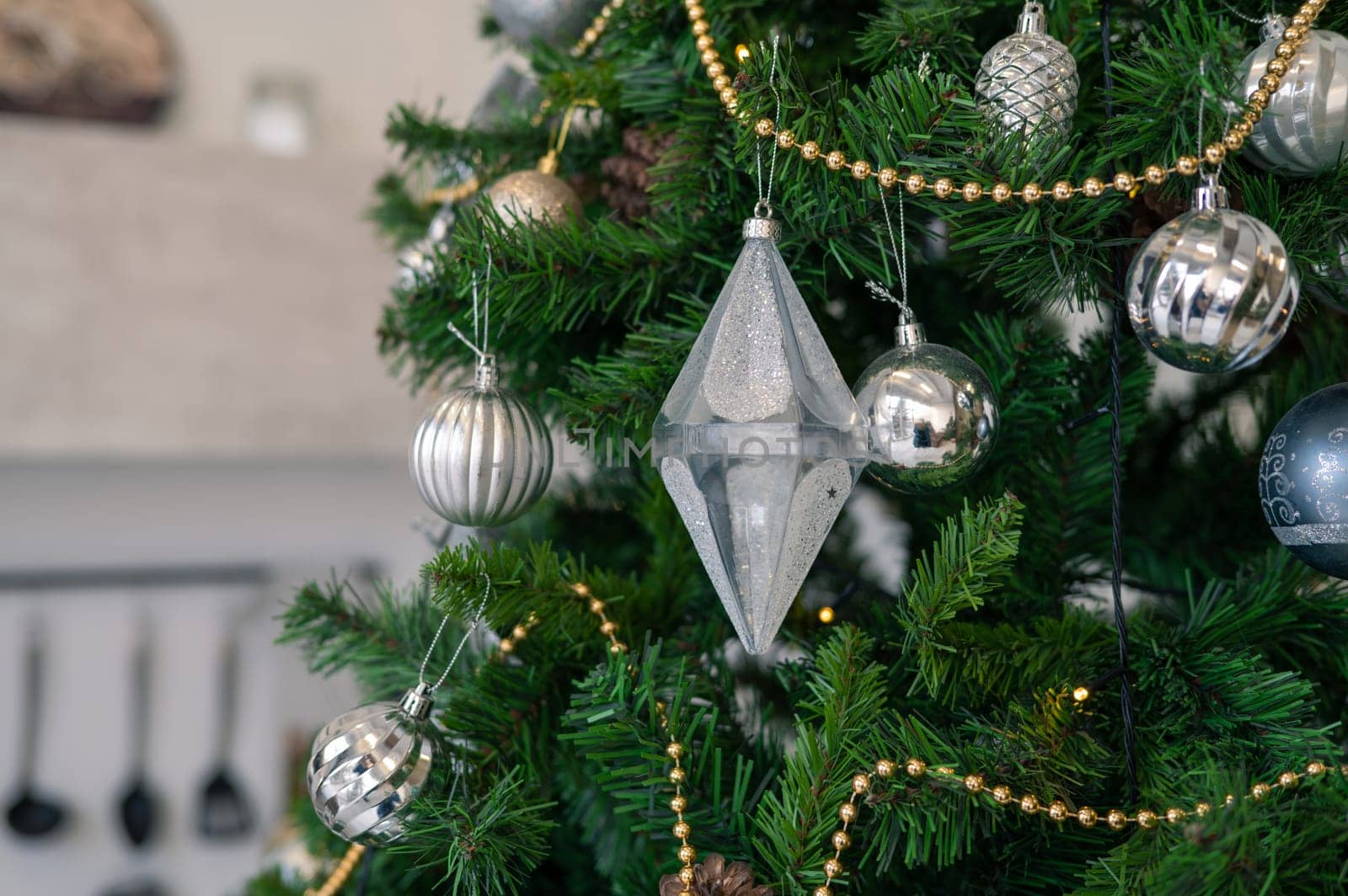 Christmas tree branch decorated with beauty balls and other christmas tree decoration